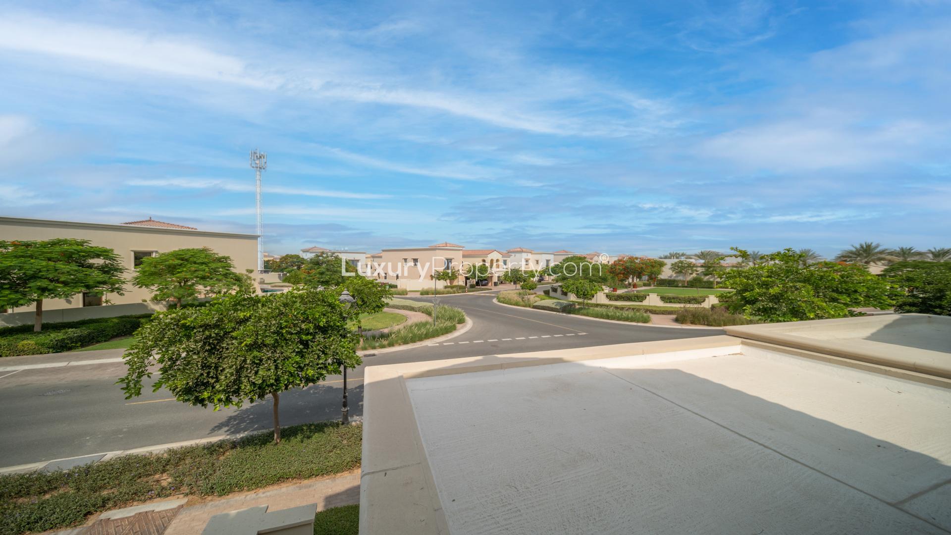 Bright living room in Arabian Ranches 2 Samara villa, featuring large windows and patio doors