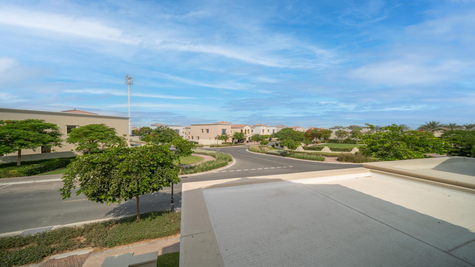 Bright living room in Arabian Ranches 2 Samara villa, featuring large windows and patio doors