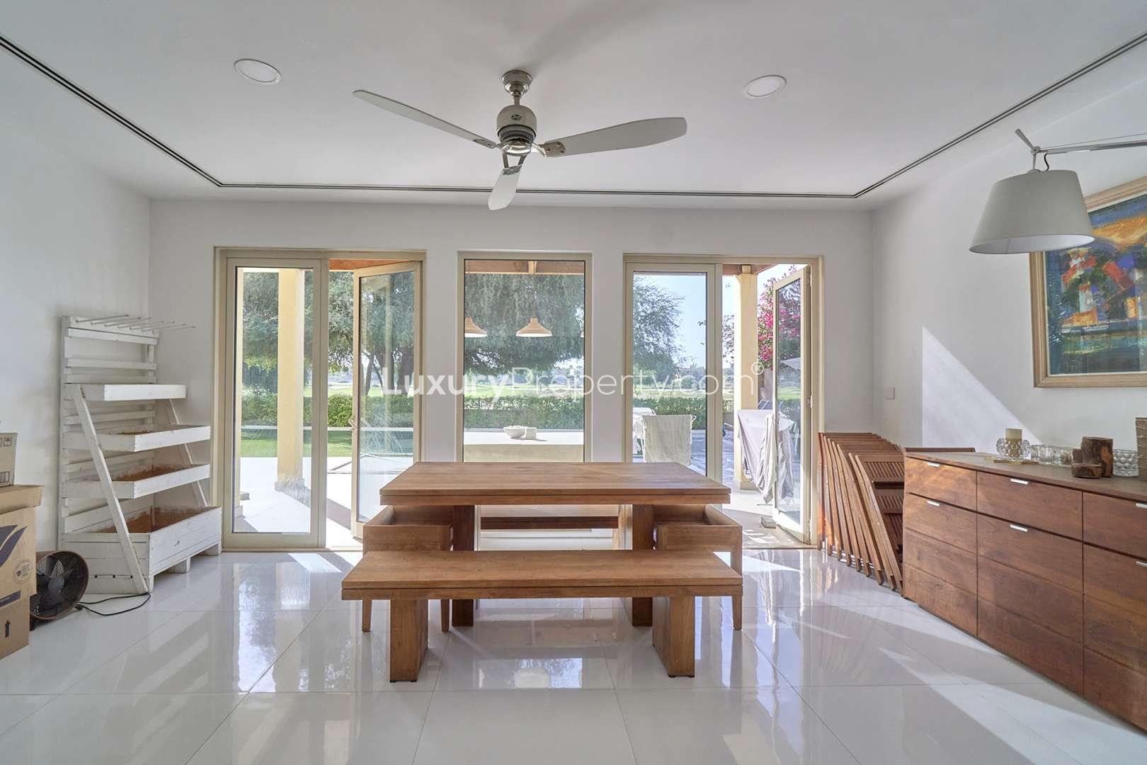 Upgraded 5-bedroom villa exterior in Savannah, Arabian Ranches with garage and car parked outside