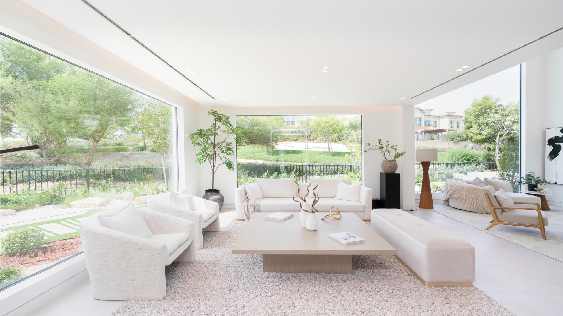 Luxurious living room in 5-bedroom Mediterranean villa, Jumeirah Islands, with park views