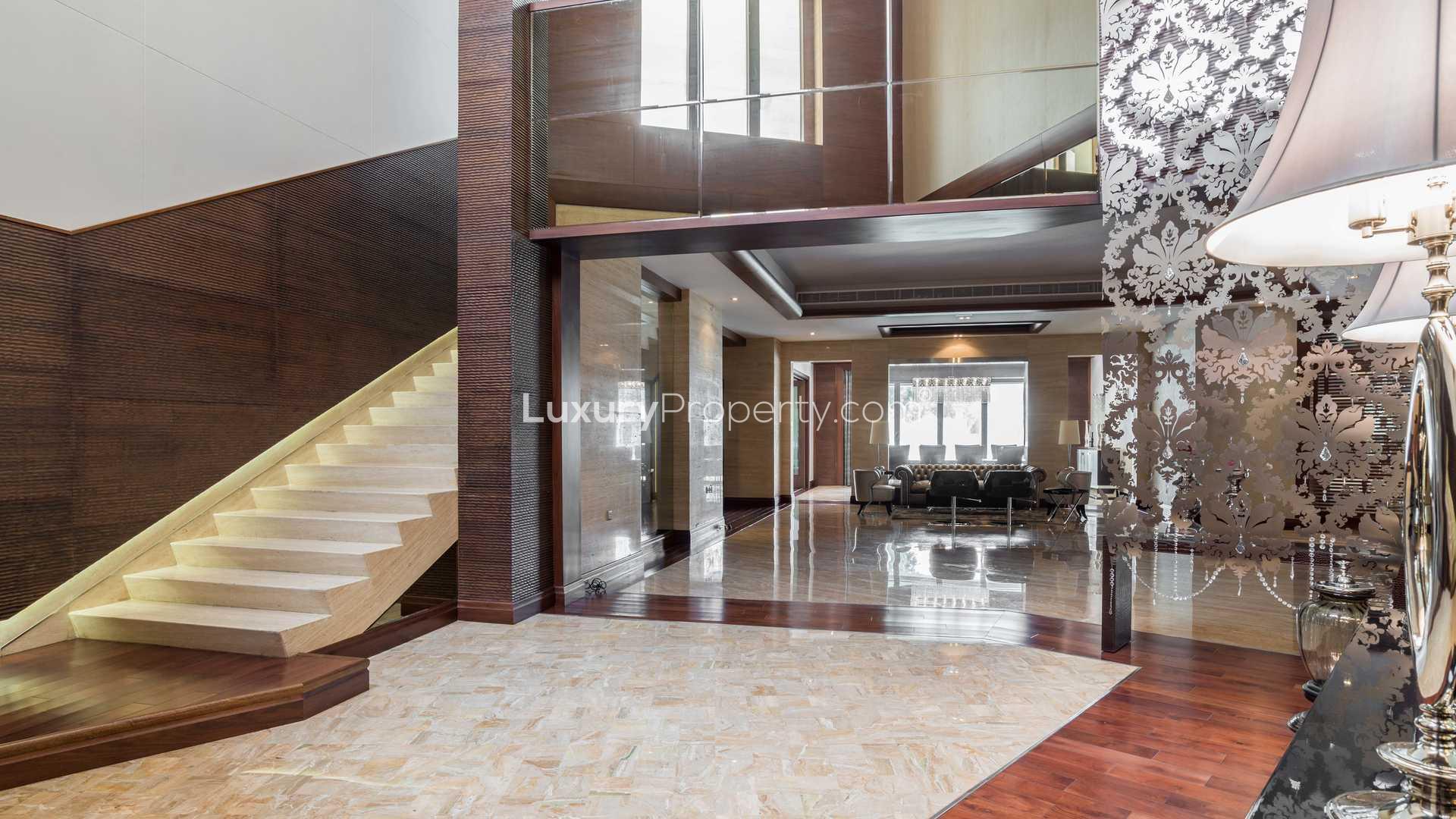 Luxury villa garden and pathway in Emirates Hills, Sector P, lush greenery surrounds