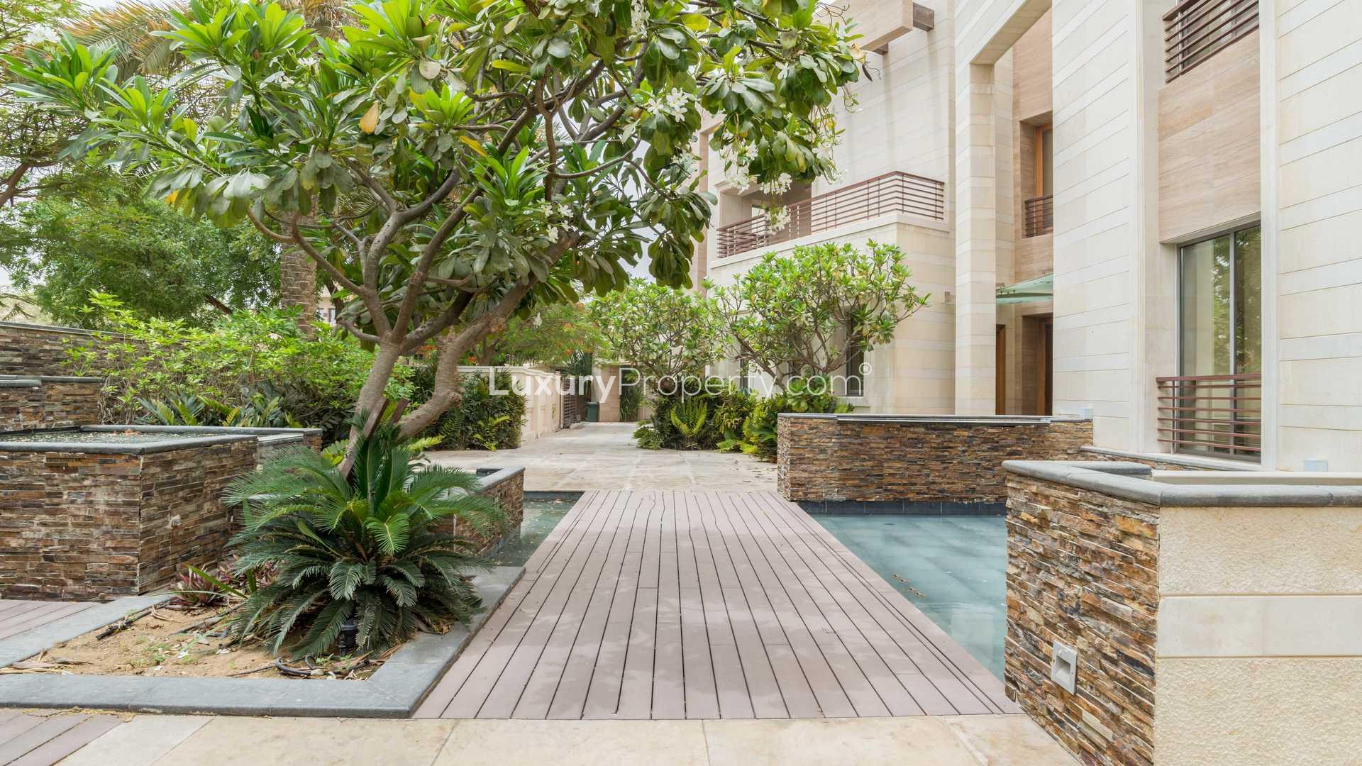 Exterior view of luxury 5-bed villa with garden in Emirates Hills, Sector P