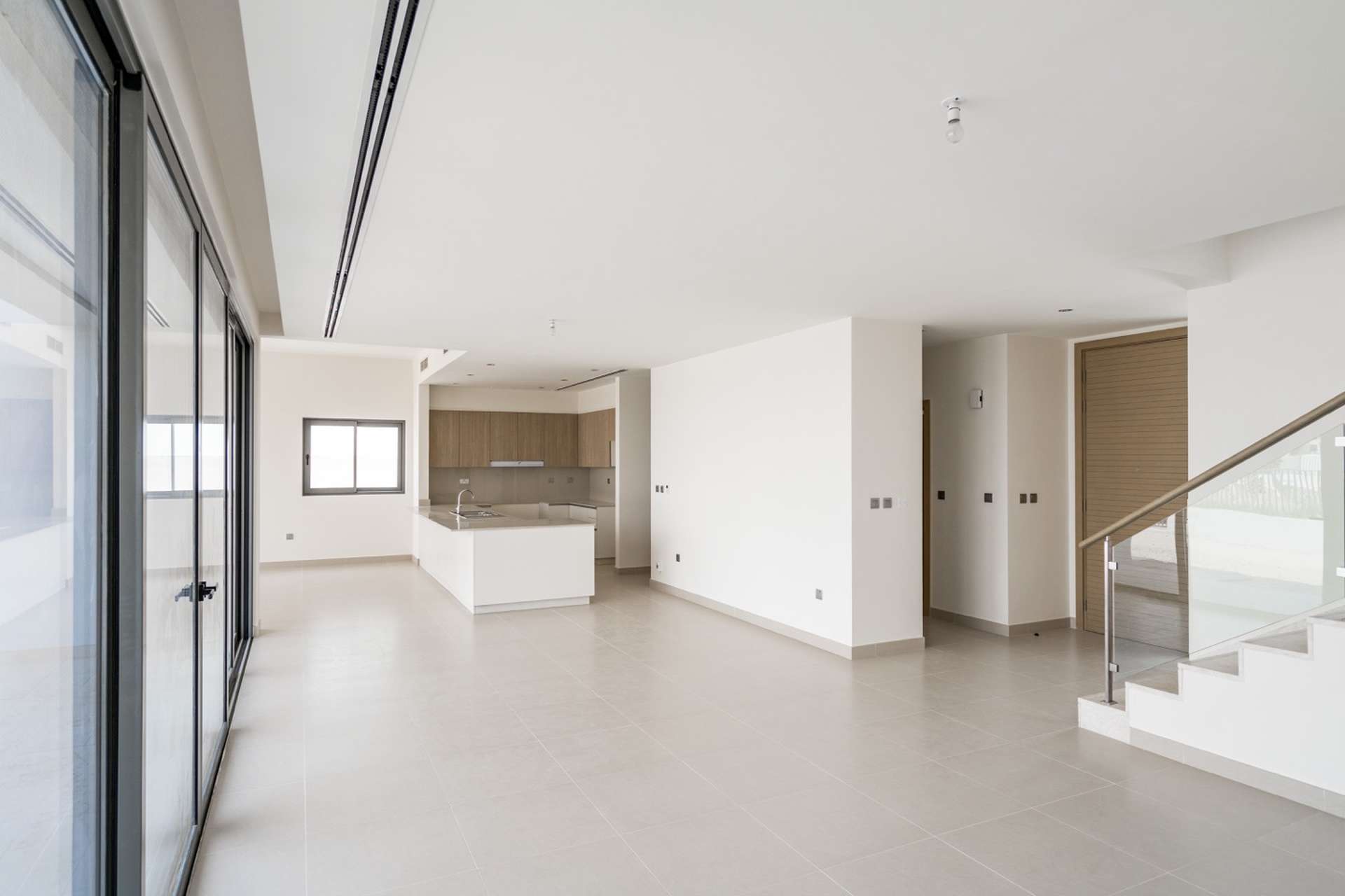 Modern open-plan kitchen and living area in 5-bedroom villa, Sidra Phase 2, Dubai Hills Estate