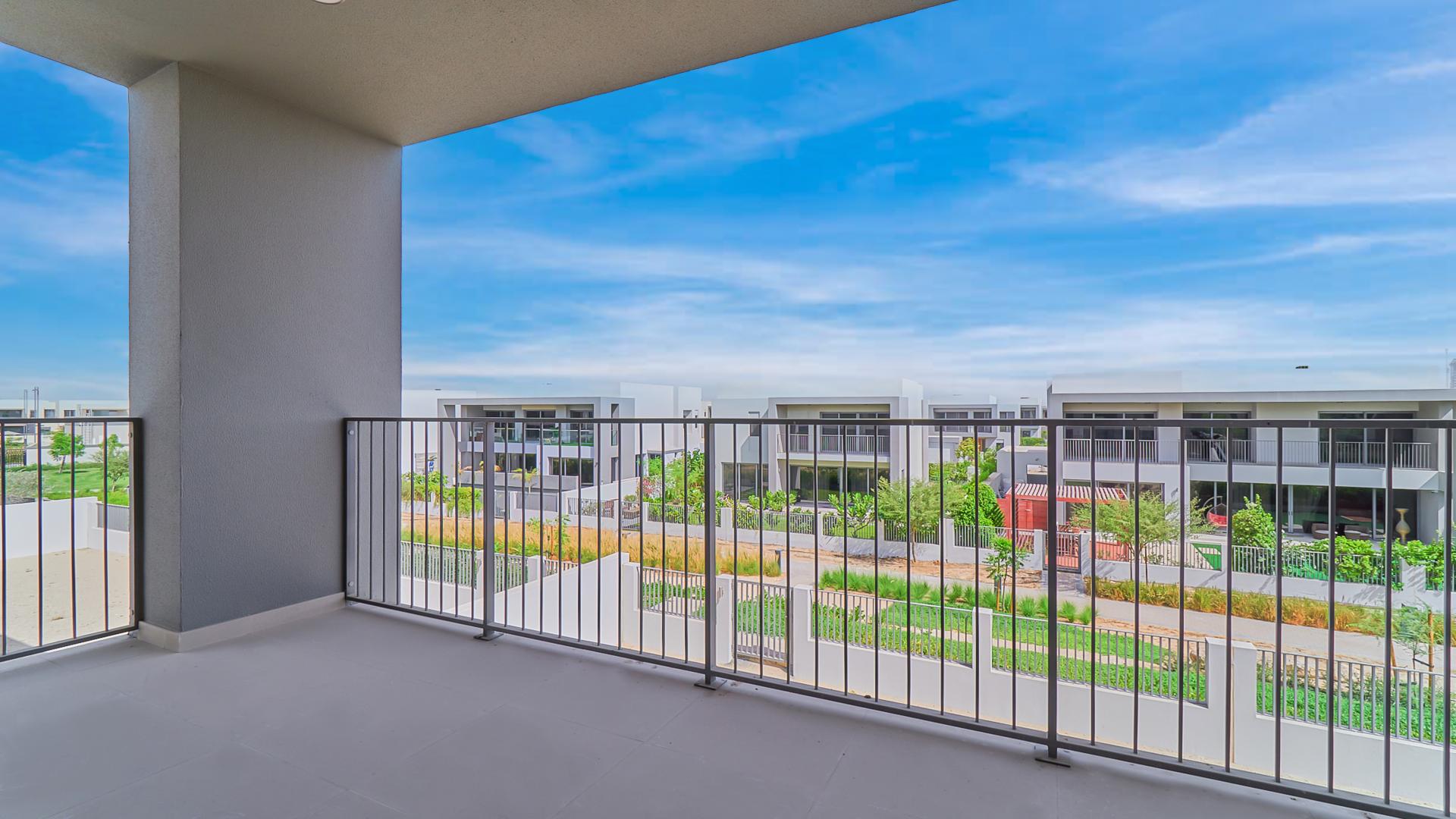 Balcony view of Sidra Villas in Dubai Hills Estate, showcasing modern architecture and greenery