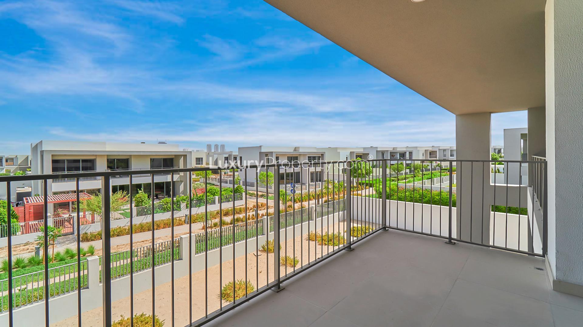 Balcony view of modern villas in Sidra, Dubai Hills Estate, showcasing lush green community