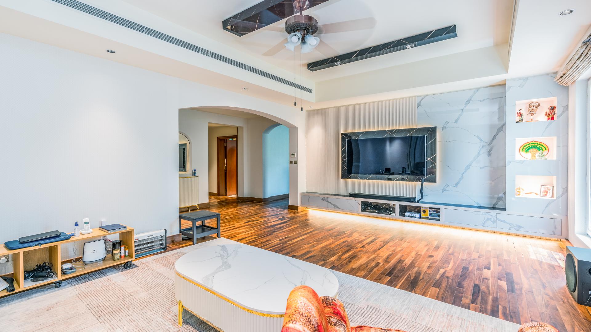 Luxurious villa exterior in Mirador La Coleccion, Arabian Ranches, with lush garden landscaping