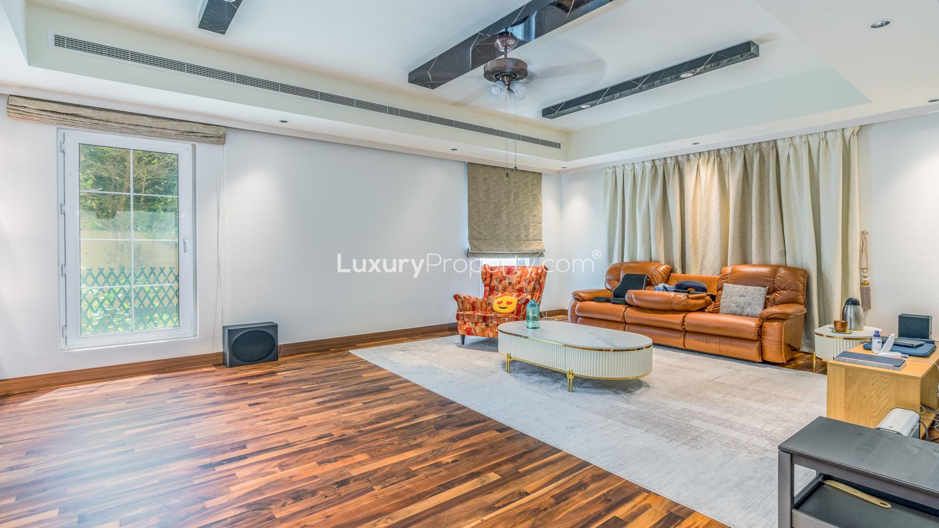 Luxurious villa exterior with lush garden in Mirador La Coleccion, Arabian Ranches