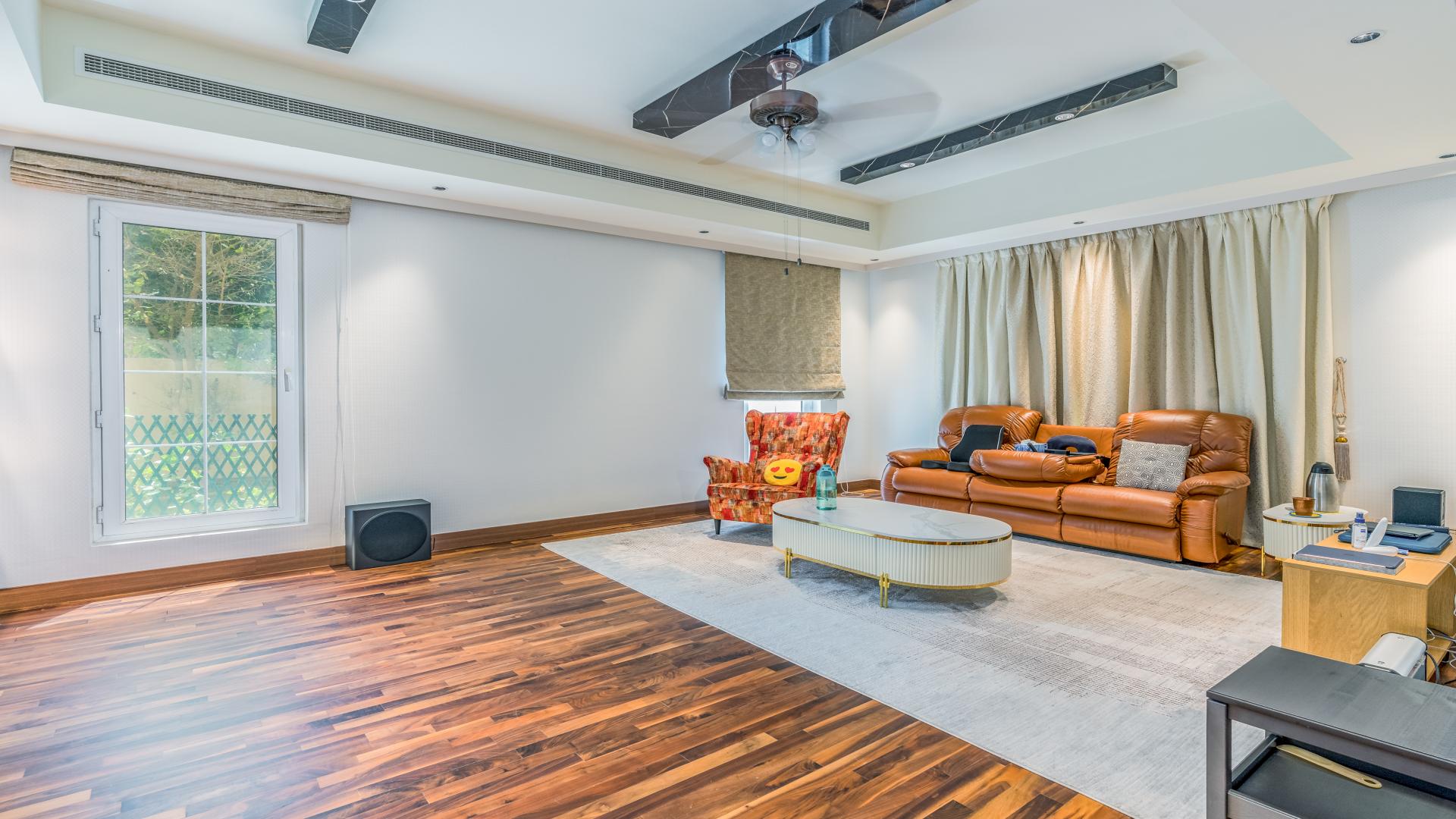 Luxurious villa exterior with lush garden in Mirador La Coleccion, Arabian Ranches