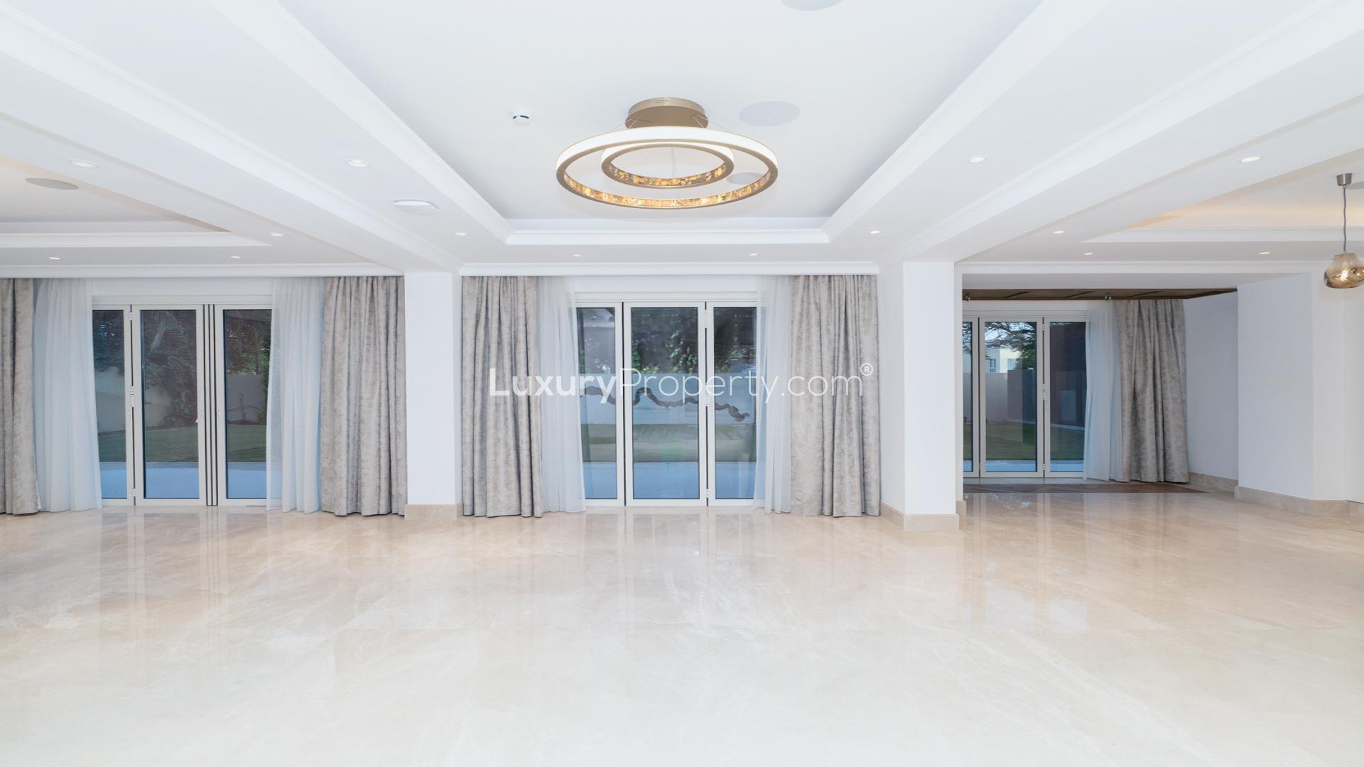 "Spacious living area in extended villa, Mirador La Coleccion, Arabian Ranches 1, for sale.",Spacious living area with large windows in Mirador La Coleccion villa, Arabian Ranches