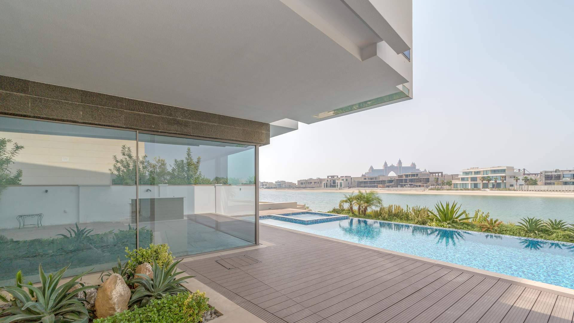 Ultra-luxury beachfront mansion exterior in Palm Jumeirah's Signature Villas, Dubai