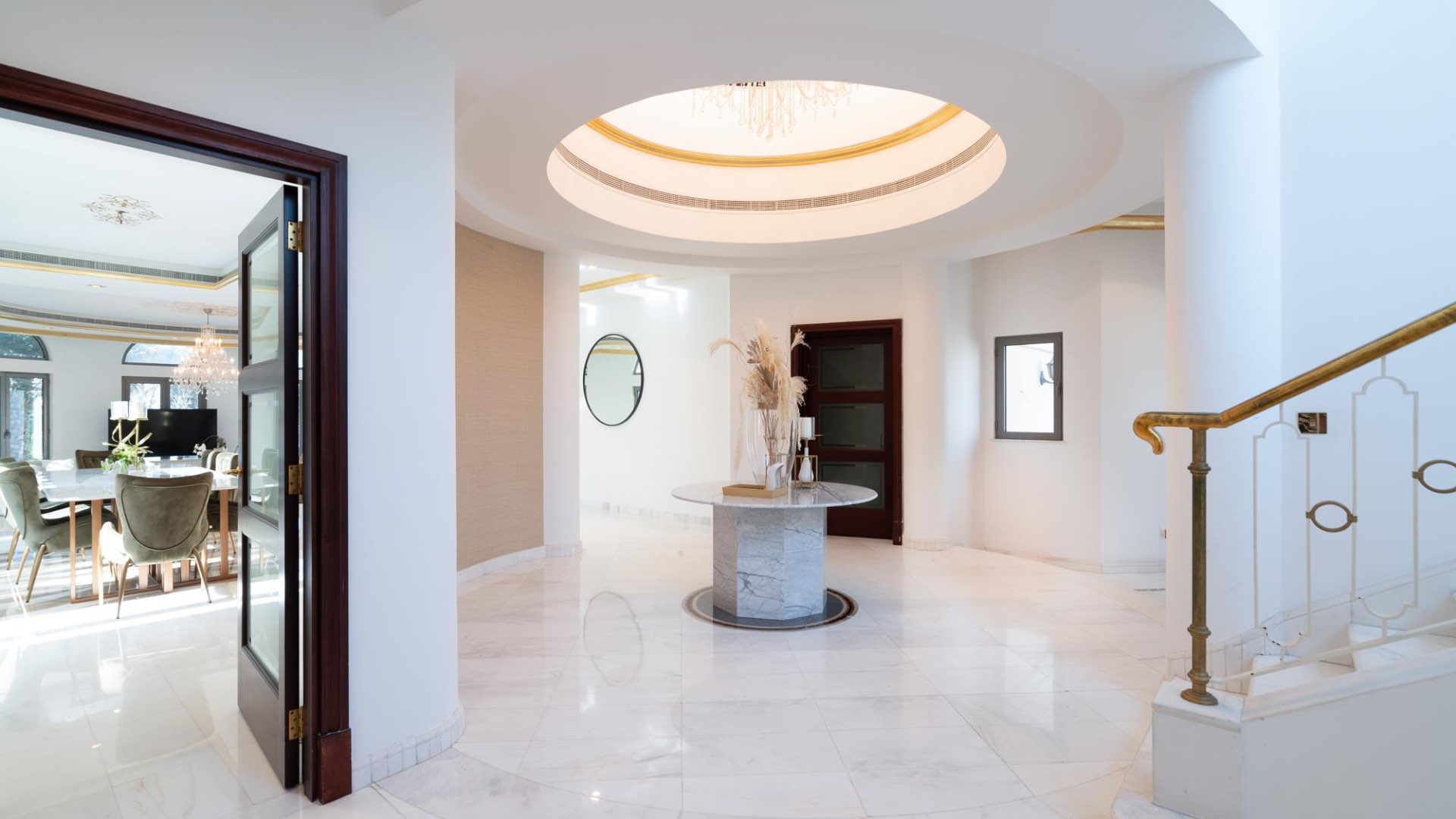 Elegant entrance of five-bedroom villa on Palm Jumeirah with marble floors and stylish decor