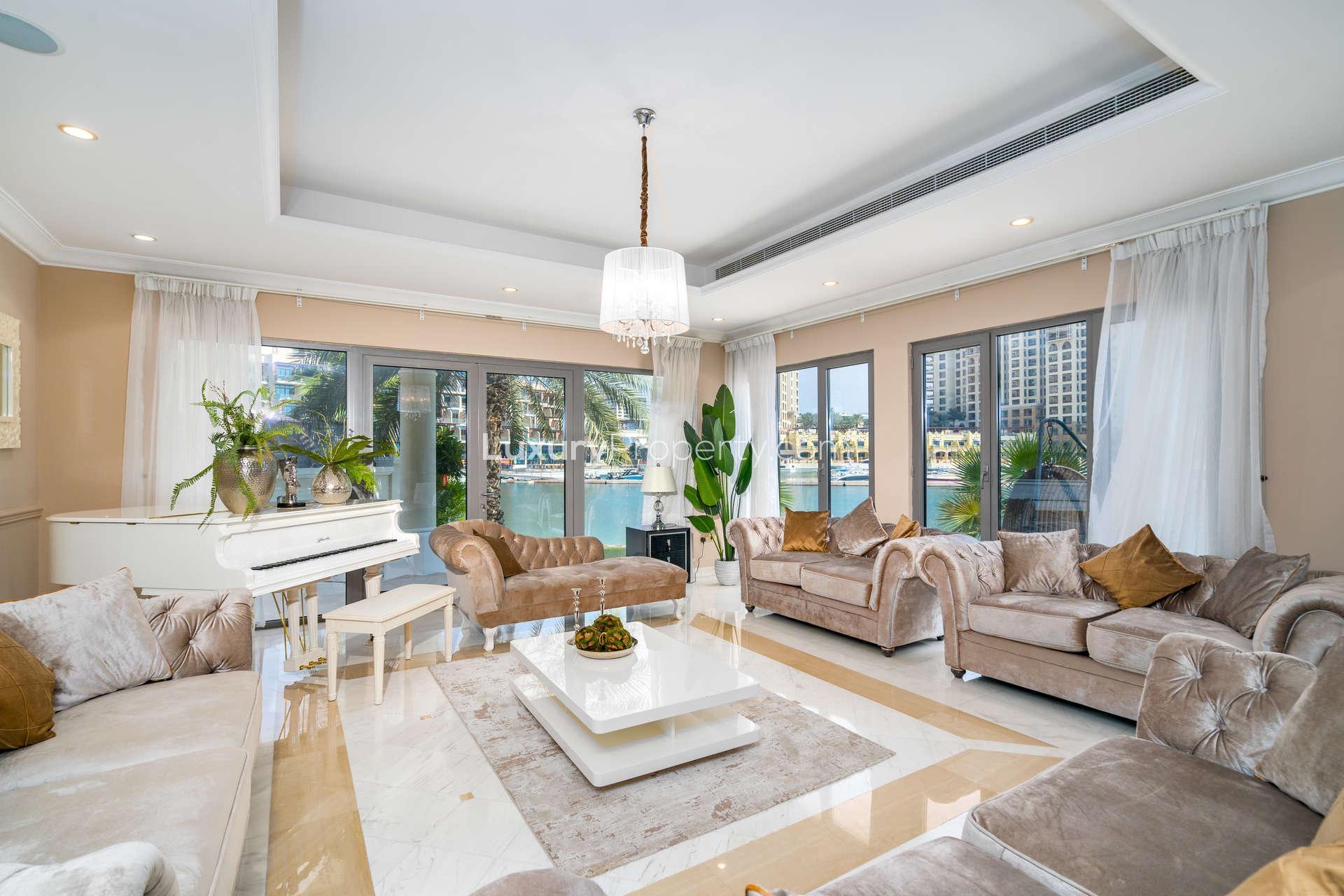 Luxurious living room in Palm Jumeirah villa with sea views and elegant decor