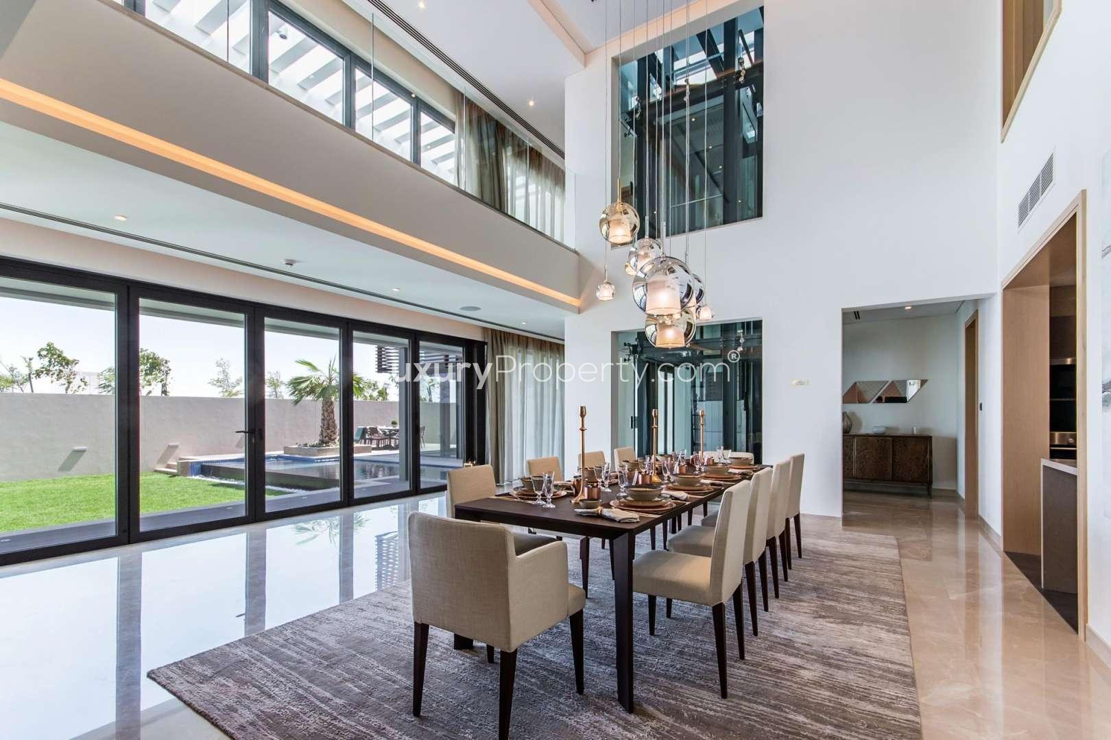 Elegant entryway of modern villa in Hartland Estates, featuring stylish decor and natural light