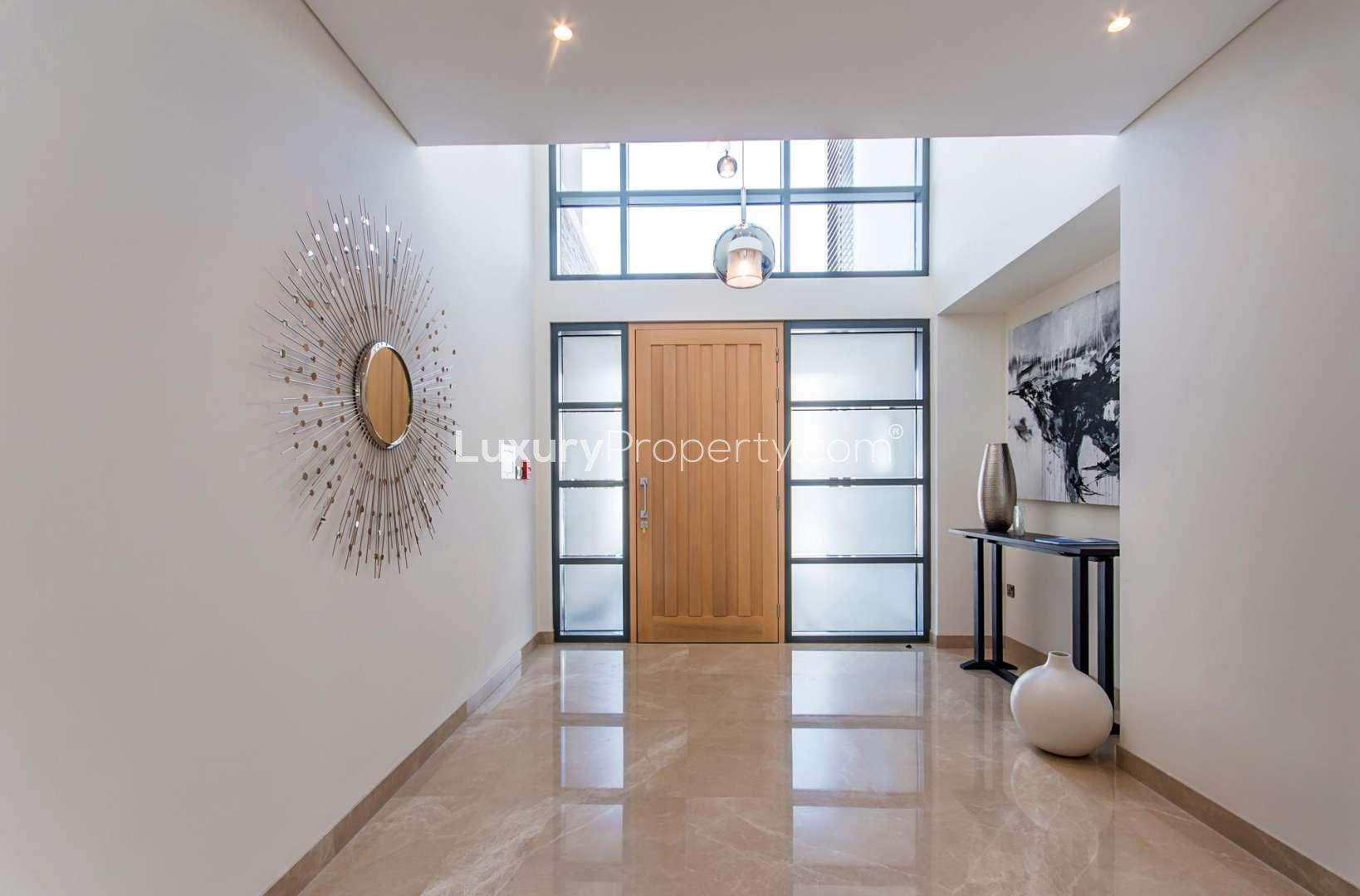 "Stunning 5-bedroom villa with pool in Sobha Hartland, Mohammed Bin Rashid City for sale.","Elegant entrance of 5-bedroom villa in Sobha Hartland, Mohammed Bin Rashid City for sale.",Gorgeous 5-bedroom villa exterior in Sobha Hartland, Mohammed Bin Rashid City for sale
