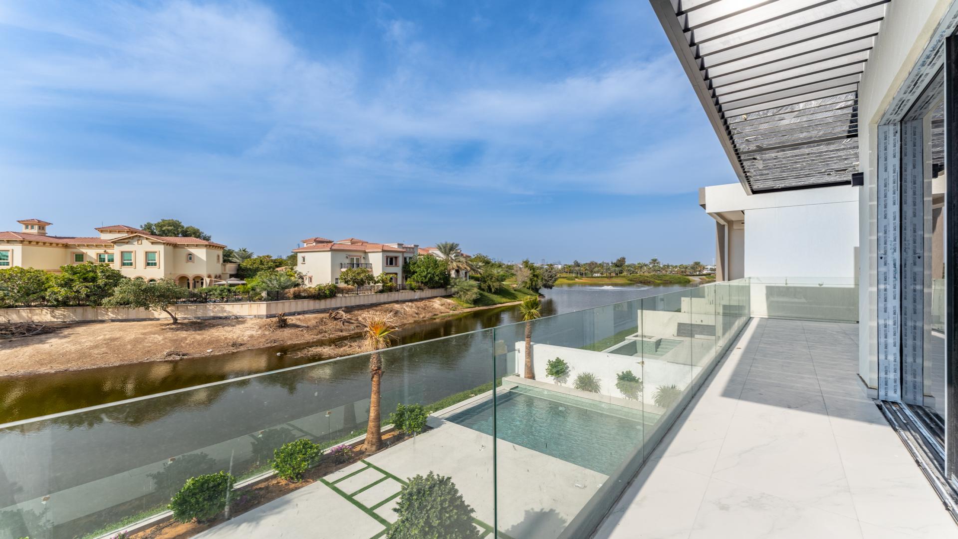 Modern staircase in luxury 5-bedroom villa, Jumeirah Park, with elegant marble and glass design