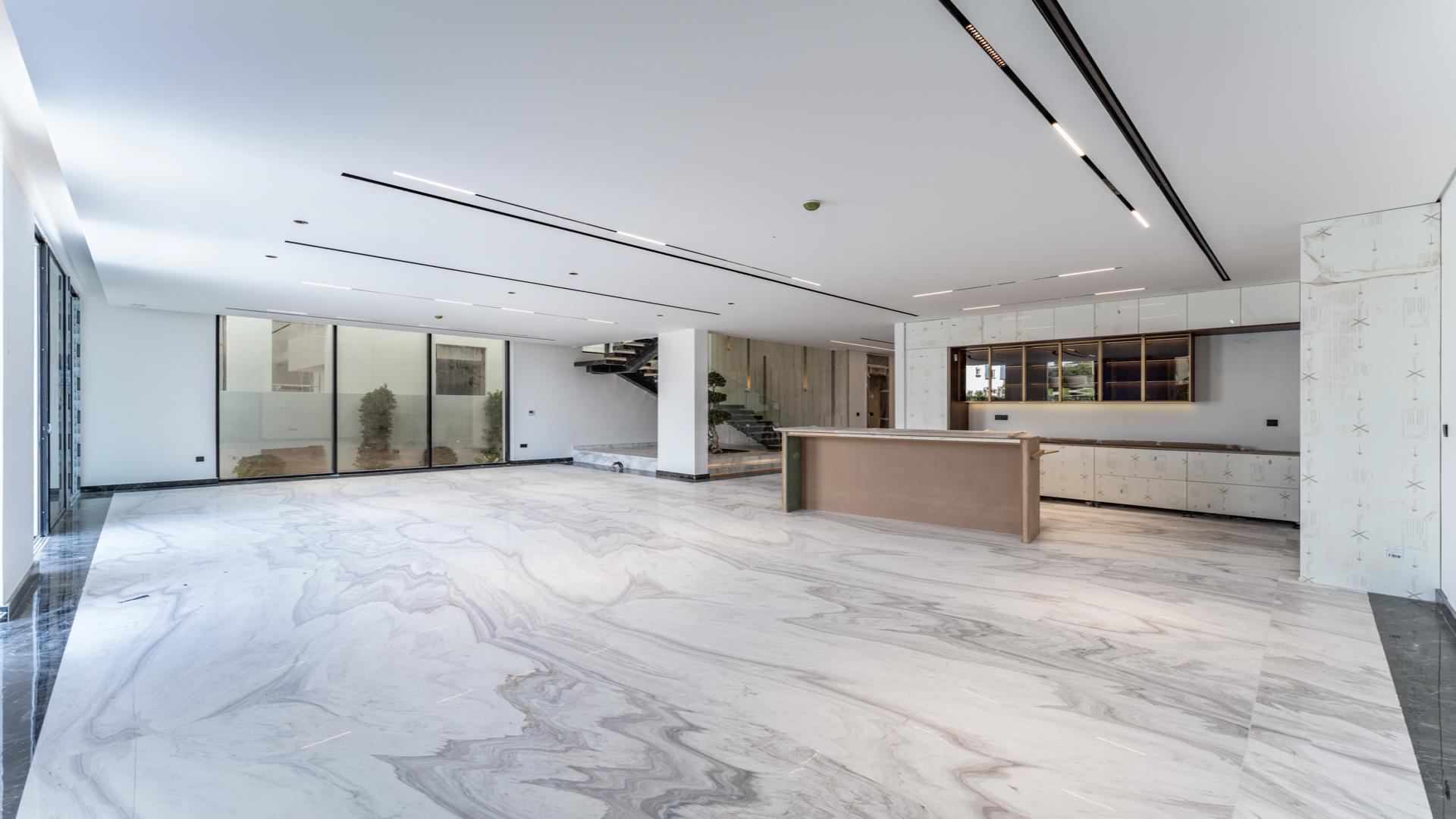 Modern staircase with glass railings in luxury Jumeirah Park villa, Regional sub-community