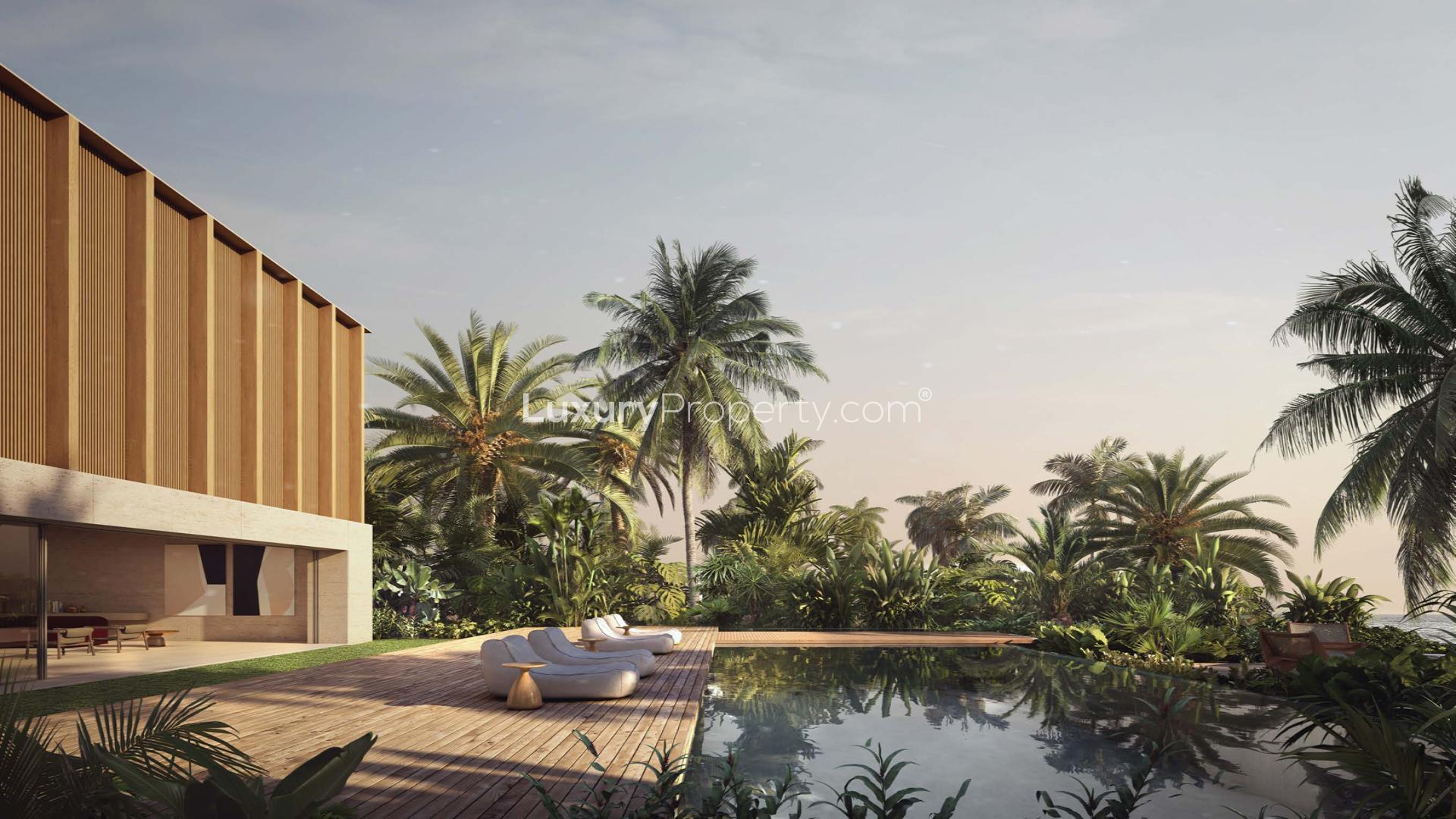 Luxurious villa interior with ocean view, elegant seating, and modern dining area in Jumeirah Bay