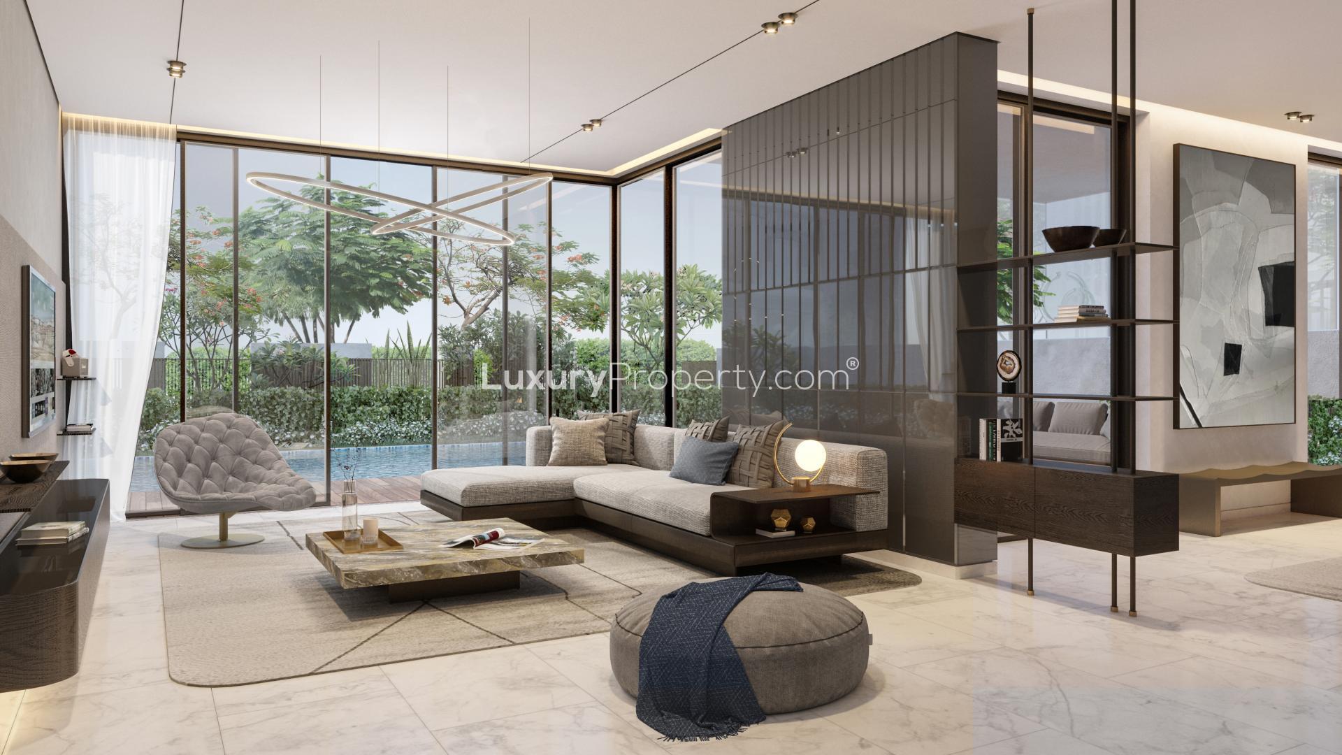 "Modern 5-bedroom villa with pool in Harmony, Tilal Al Ghaf, for sale.",Luxurious living room in 5-bedroom Harmony Villa, Tilal Al Ghaf, with pool view