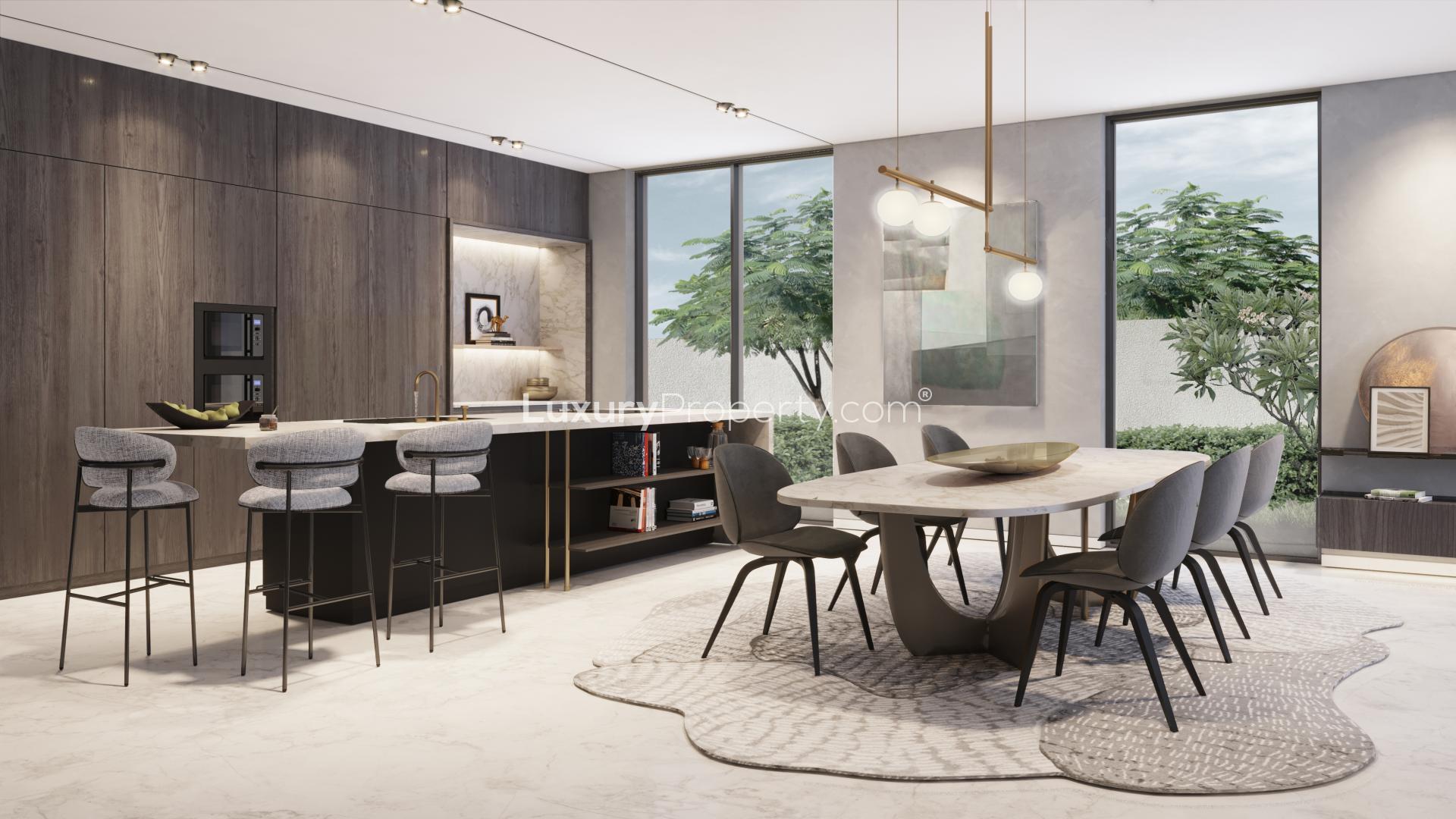 Modern kitchen and dining area in spacious 5-bedroom Harmony Villa, Tilal Al Ghaf