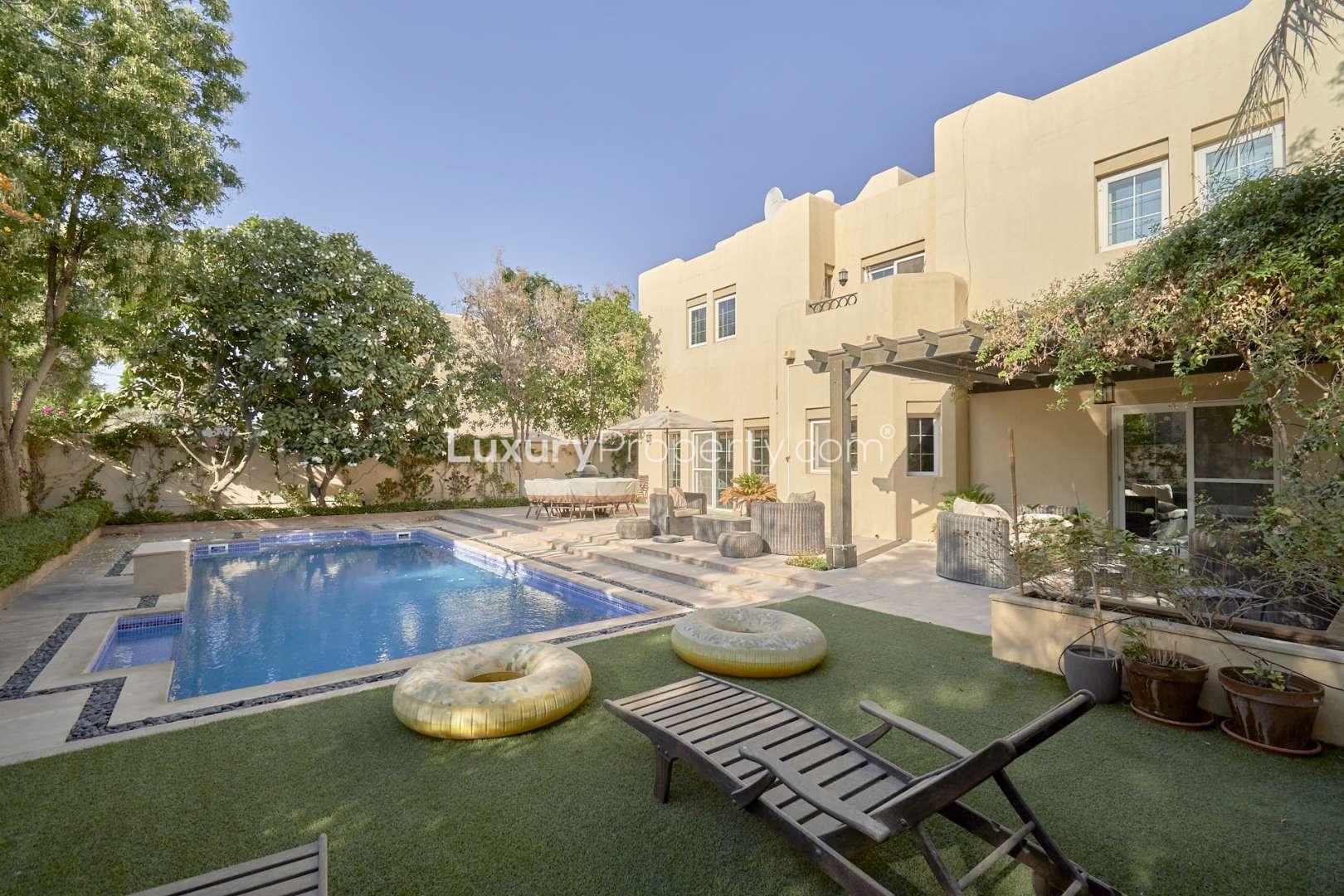 Modern kitchen with wooden cabinets in Terra Nova villa, Arabian Ranches, for sale