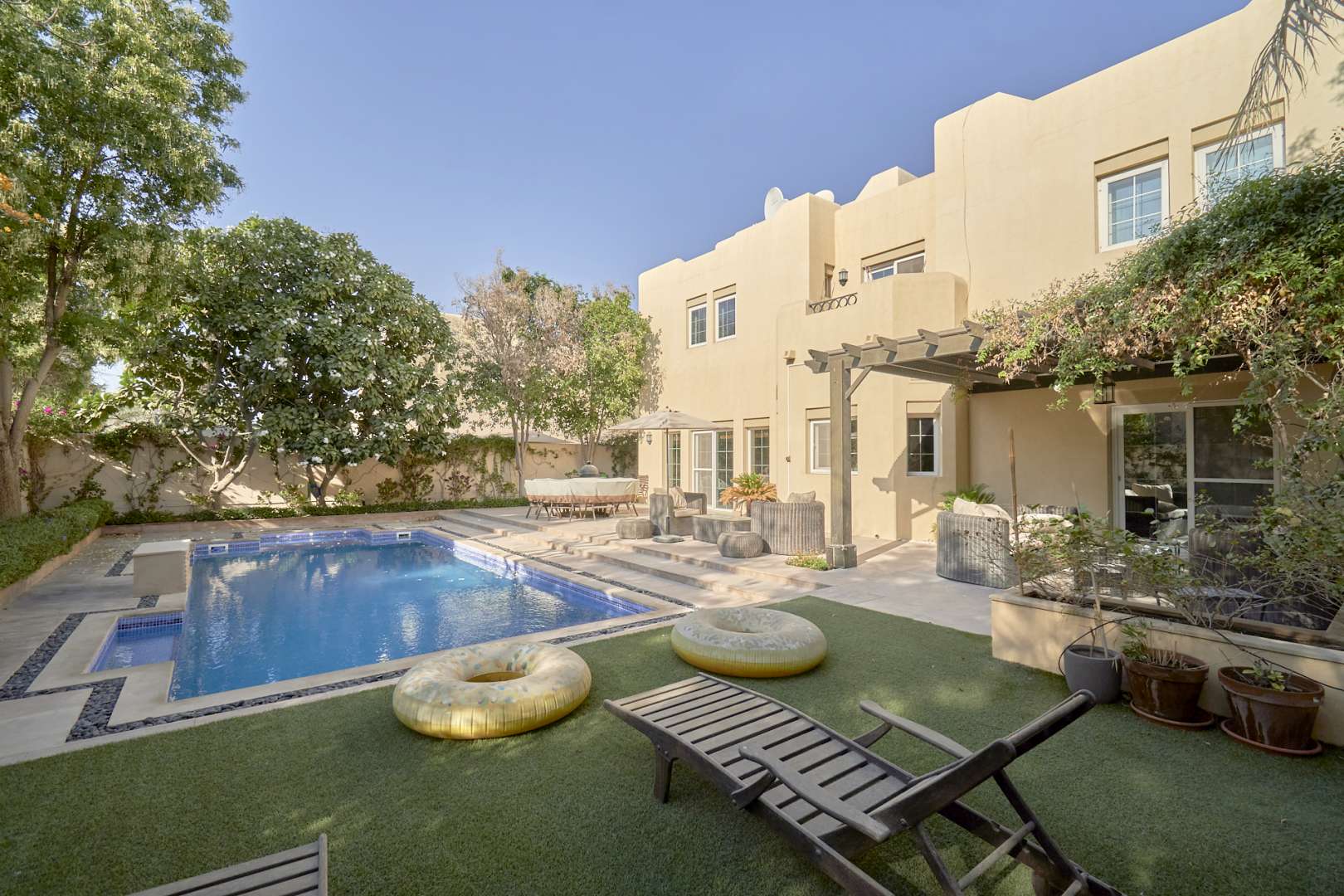 Modern kitchen with wooden cabinets in Terra Nova villa, Arabian Ranches, for sale