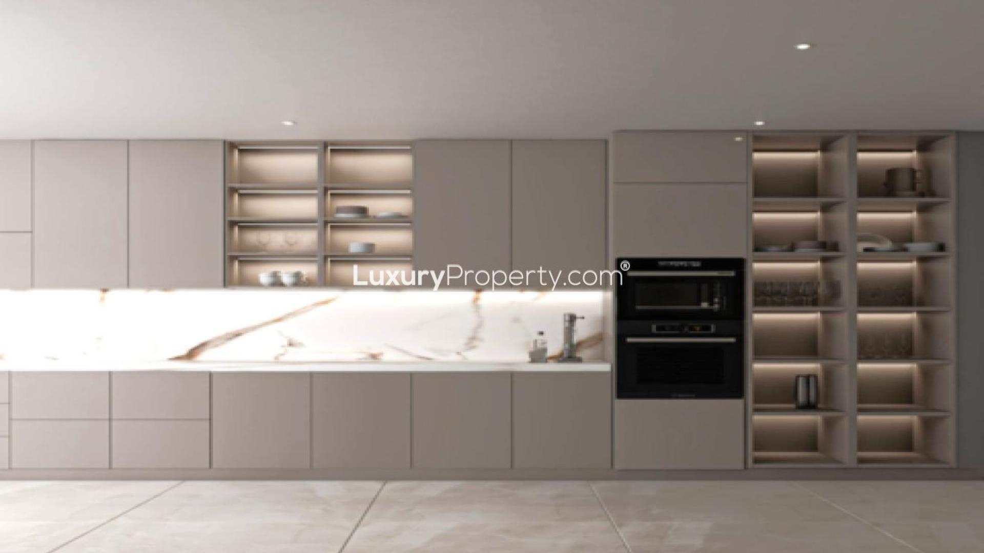 "Elegant dining room in Jumeirah Asora Bay waterfront villa, featuring modern decor and lighting.",Modern kitchen with sleek cabinetry in Jumeirah Asora Bay waterfront villa, LP44754