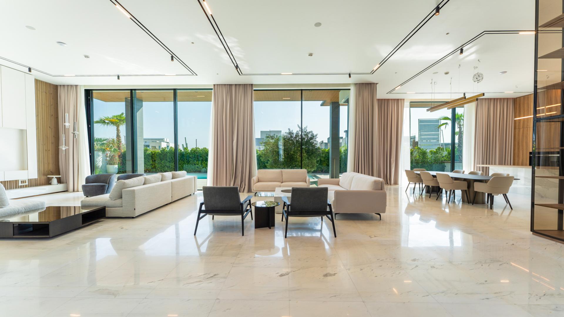 Modern villa living room with pool view in La Mer, Jumeirah