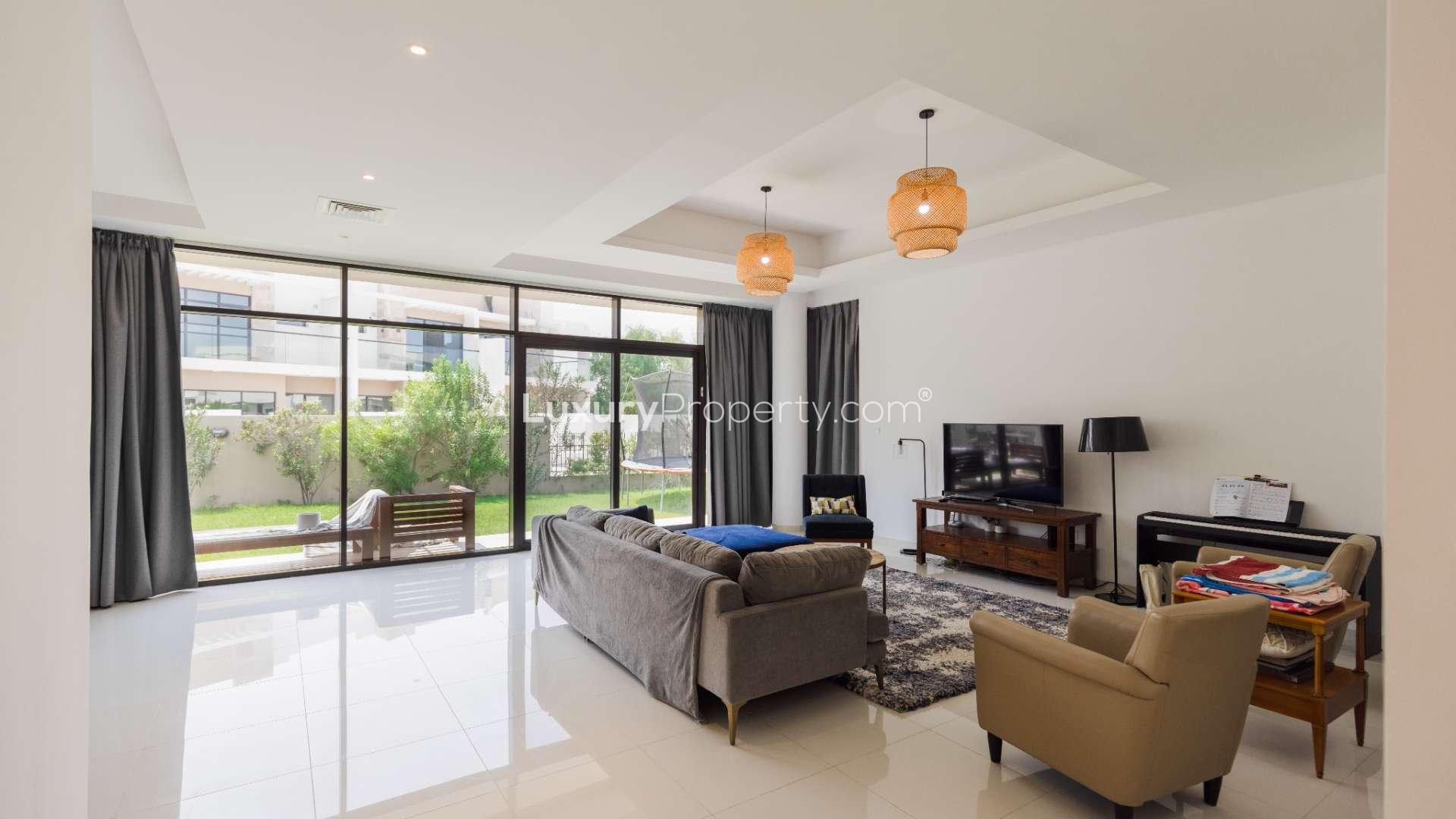 Bright living room with garden view in spacious Damac Hills villa, The Field