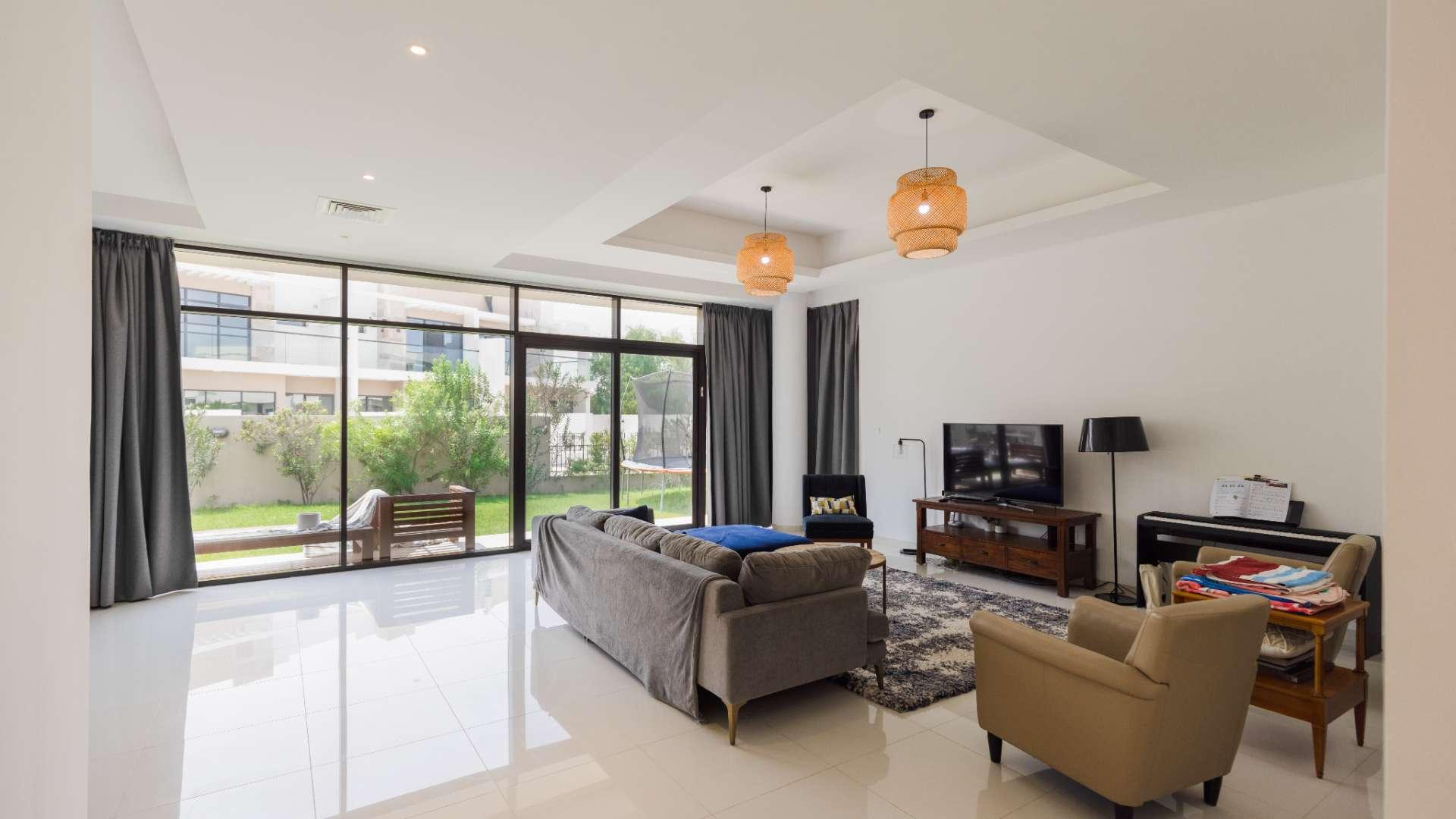 Bright living room with garden view in spacious Damac Hills villa, The Field