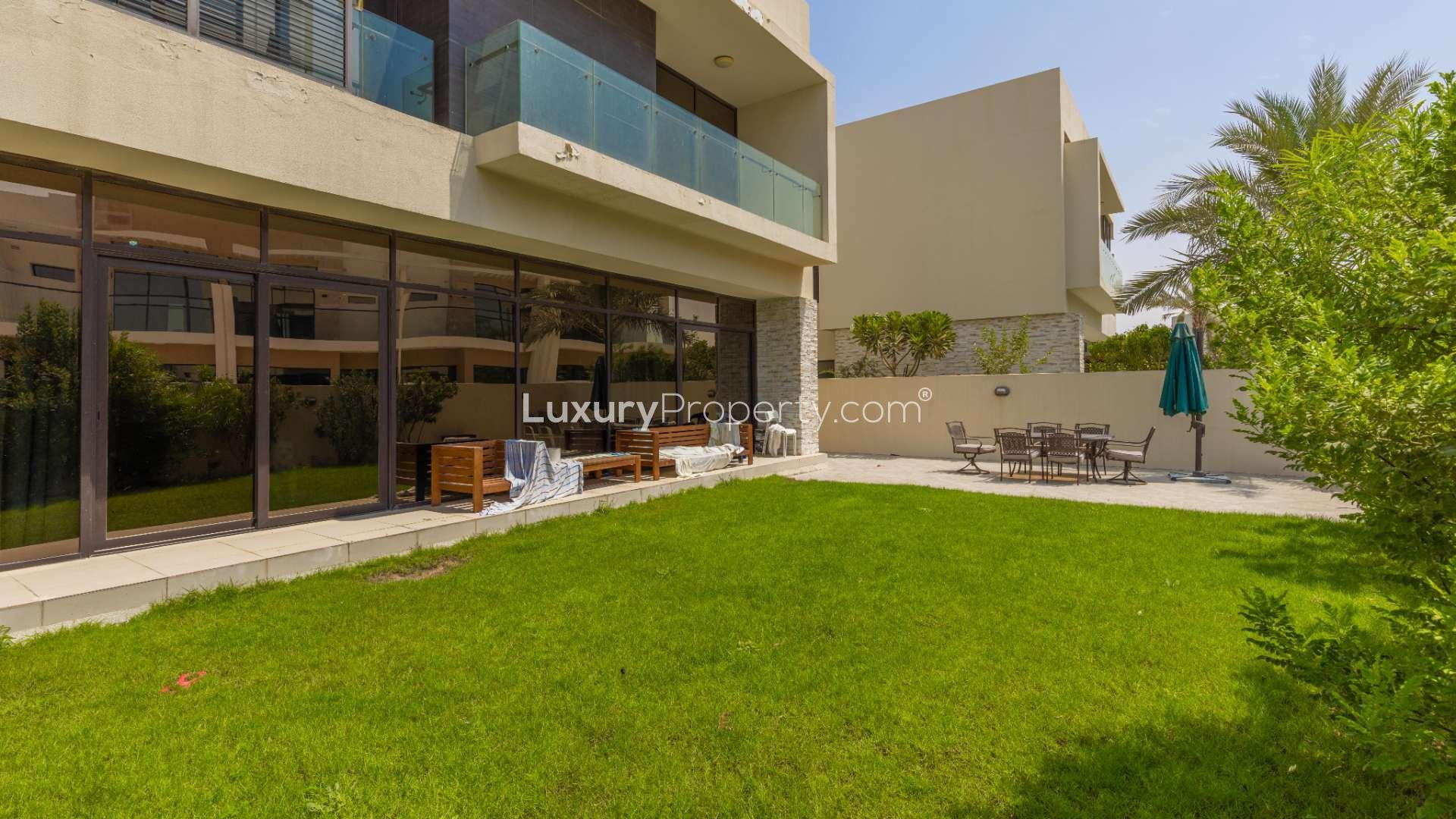 "Single row villa garden with patio furniture, trampoline in Damac Hills, The Field.",Spacious villa with large landscaped garden for sale in Damac Hills, The Field