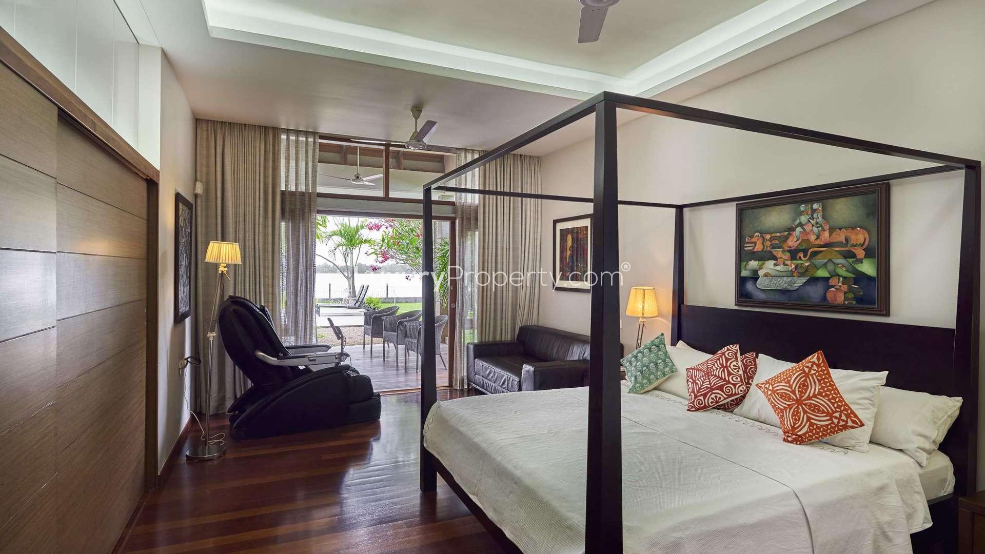 N/A,Cozy bedroom interior in Kariath Residence villa, Kochi with modern decor and warm lighting
