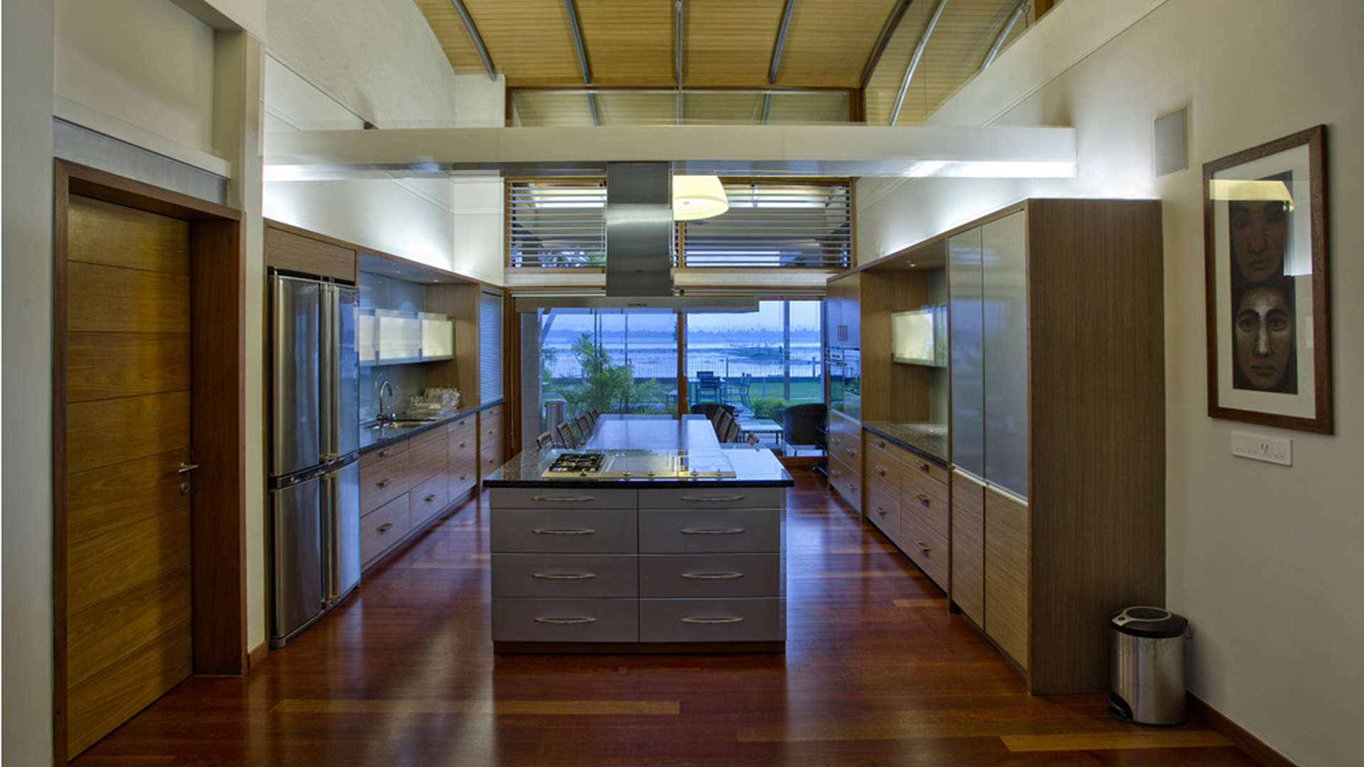 Modern kitchen interior with waterfront view in Kochi villa, The Kariath Residence