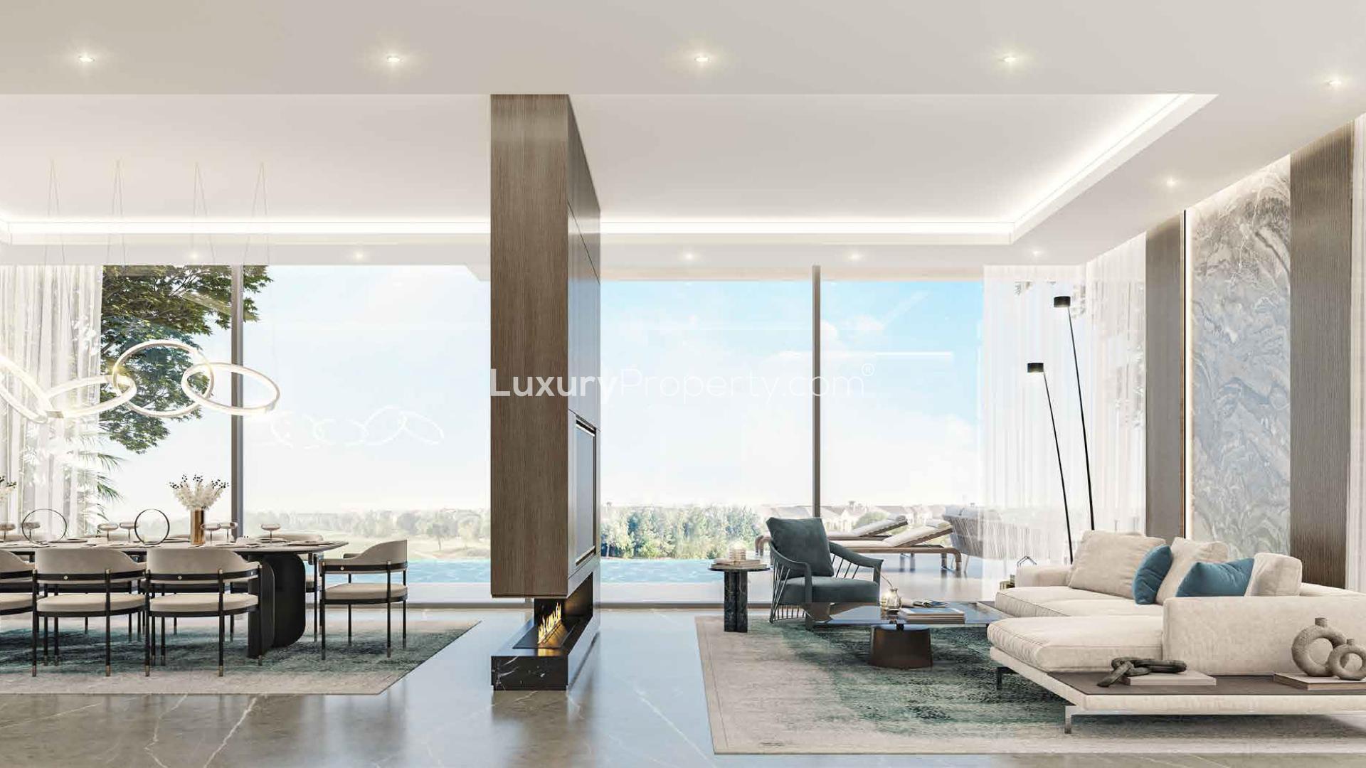 Luxurious living room in golf-facing villa, Utopia DAMAC Hills, with modern decor and lighting