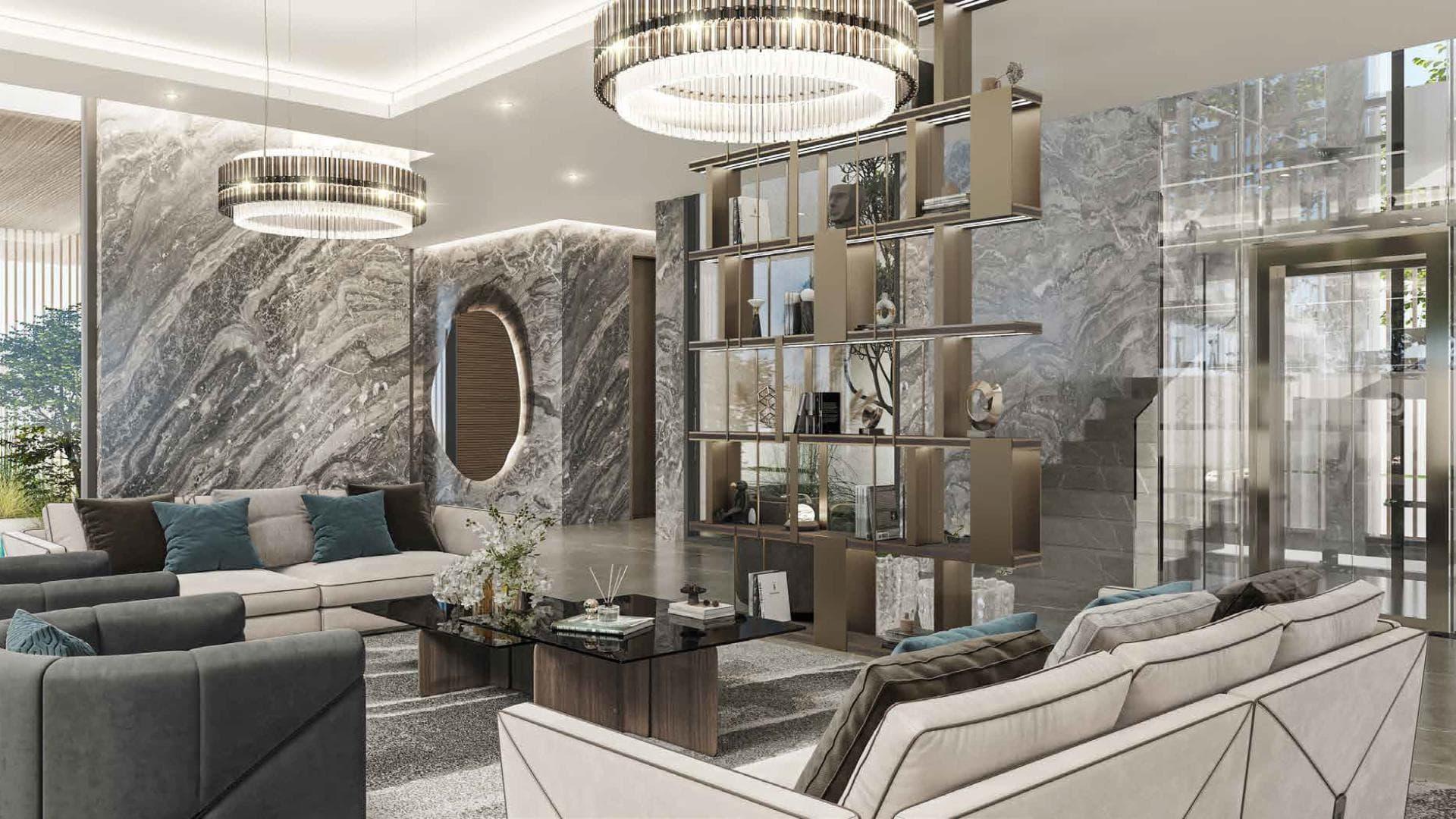 Luxurious living room in 5-bedroom villa, Utopia DAMAC Hills, featuring modern decor and lighting