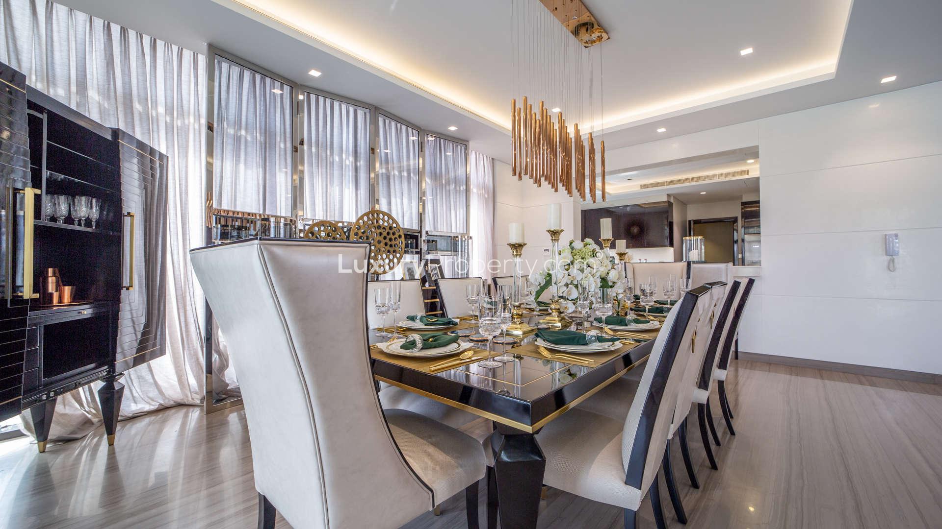 Elegant dining room in Trump Estate Villa, Damac Hills, with modern decor and natural light