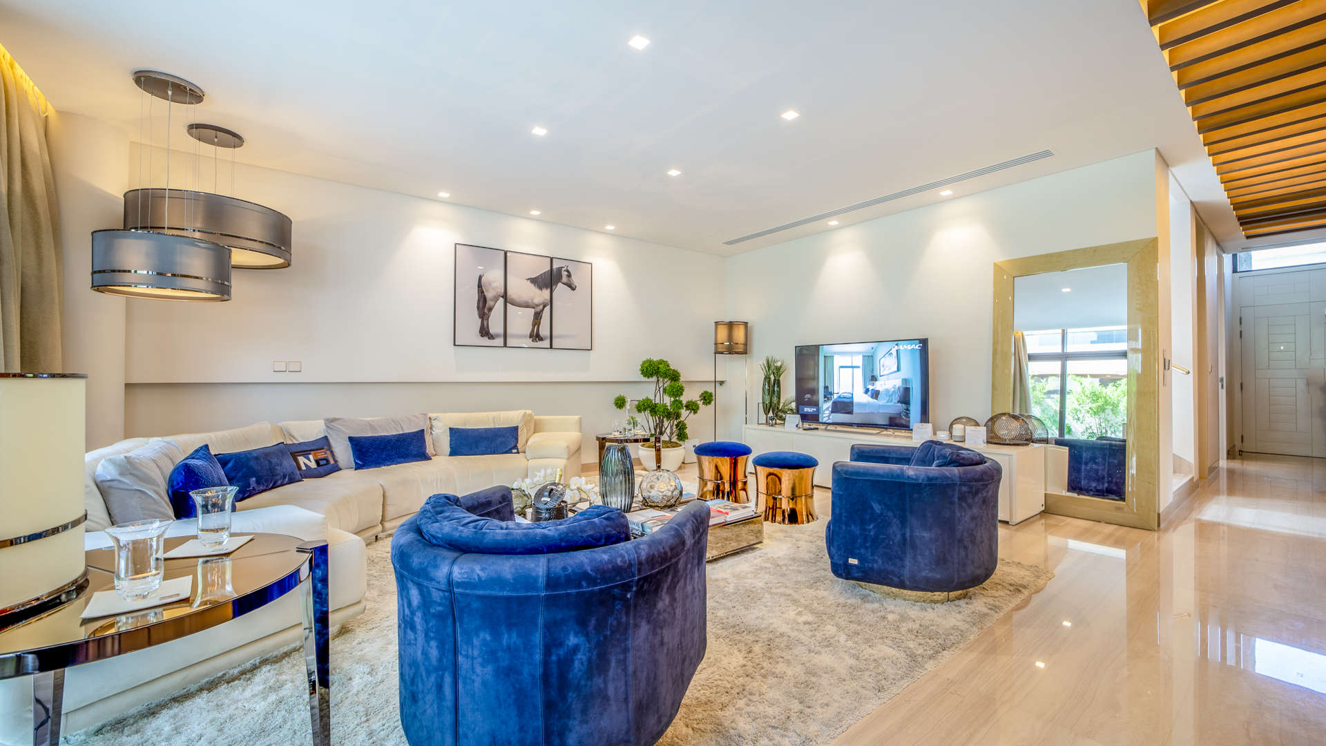 Hallway of Fendi-styled villa in Damac Hills, featuring elegant decor and wooden flooring