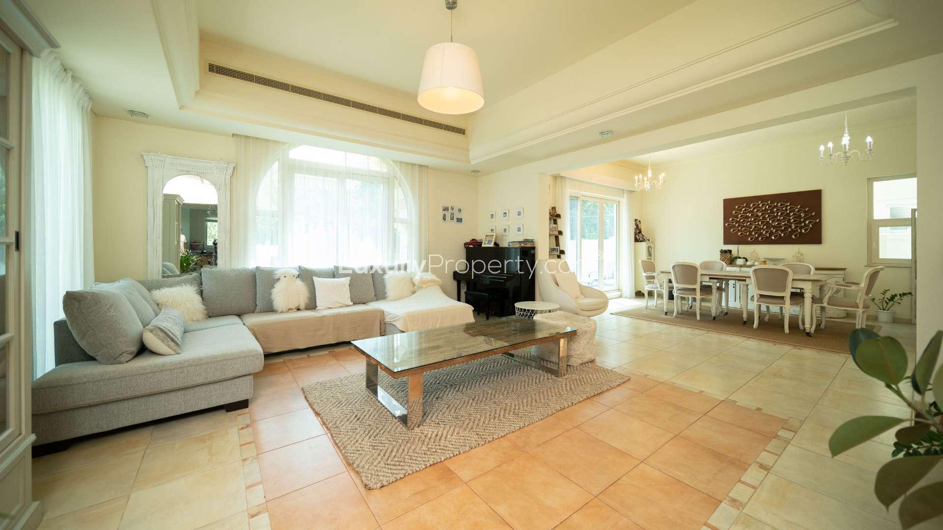 Spacious living and dining area in five-bedroom villa, Victory Heights, Dubai Sports City