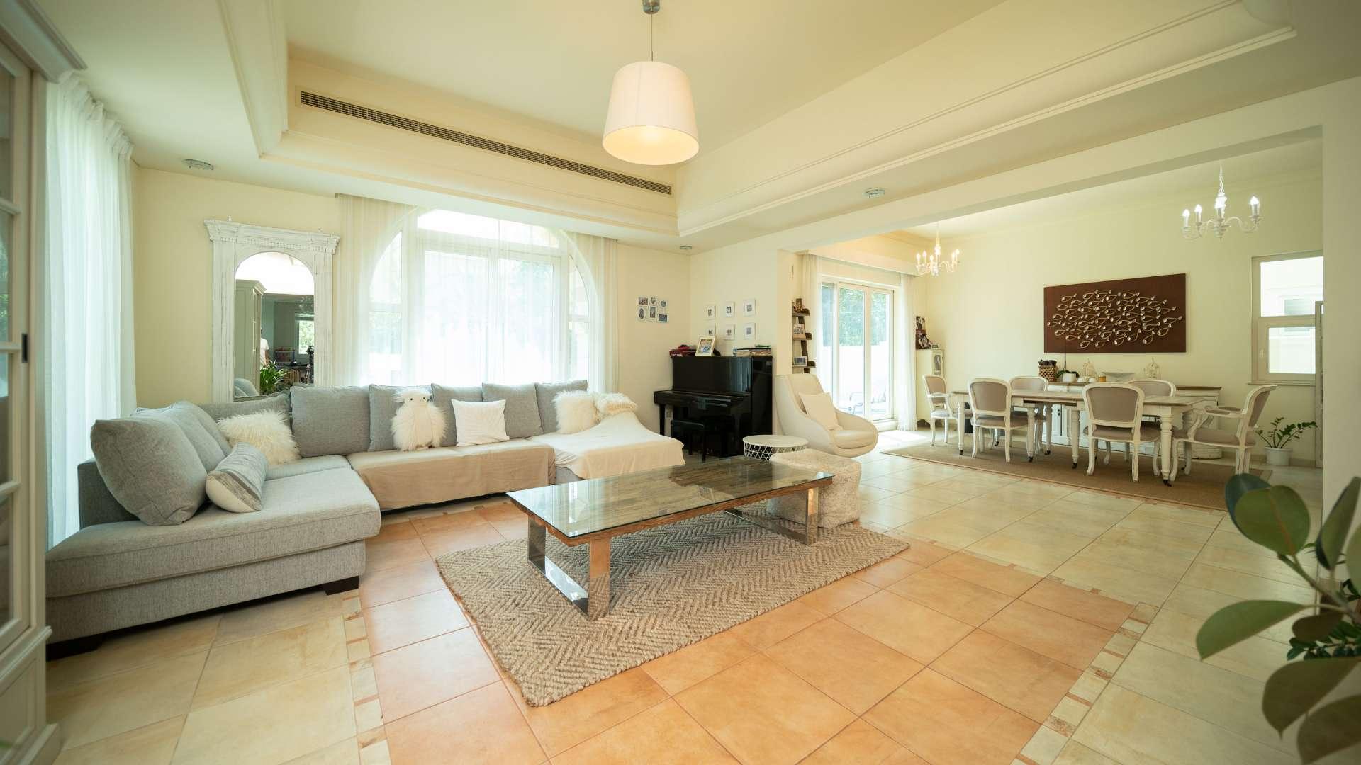 Spacious living and dining area in five-bedroom villa, Victory Heights, Dubai Sports City