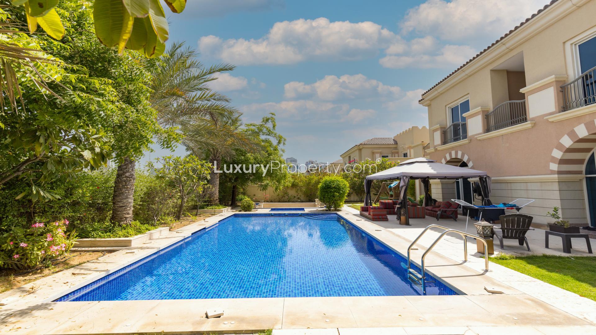 Living room of 5-bed villa in Victory Heights, Dubai Sports City, with modern decor
