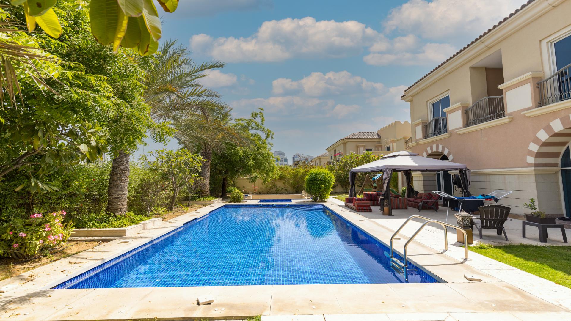 Living room of 5-bed villa in Victory Heights, Dubai Sports City, with modern decor