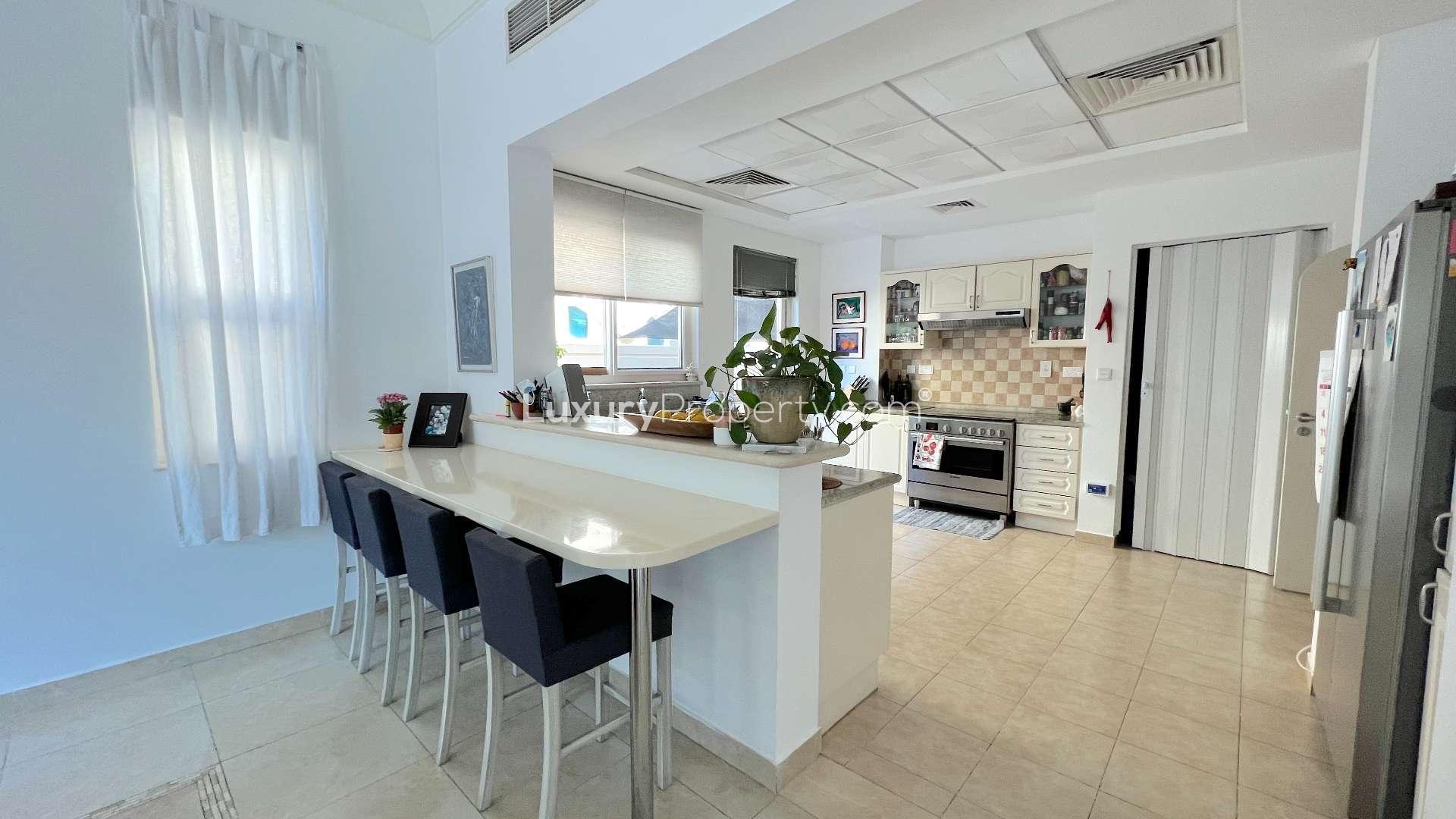 Elegant dining and living area in Victory Heights villa, Dubai Sports City