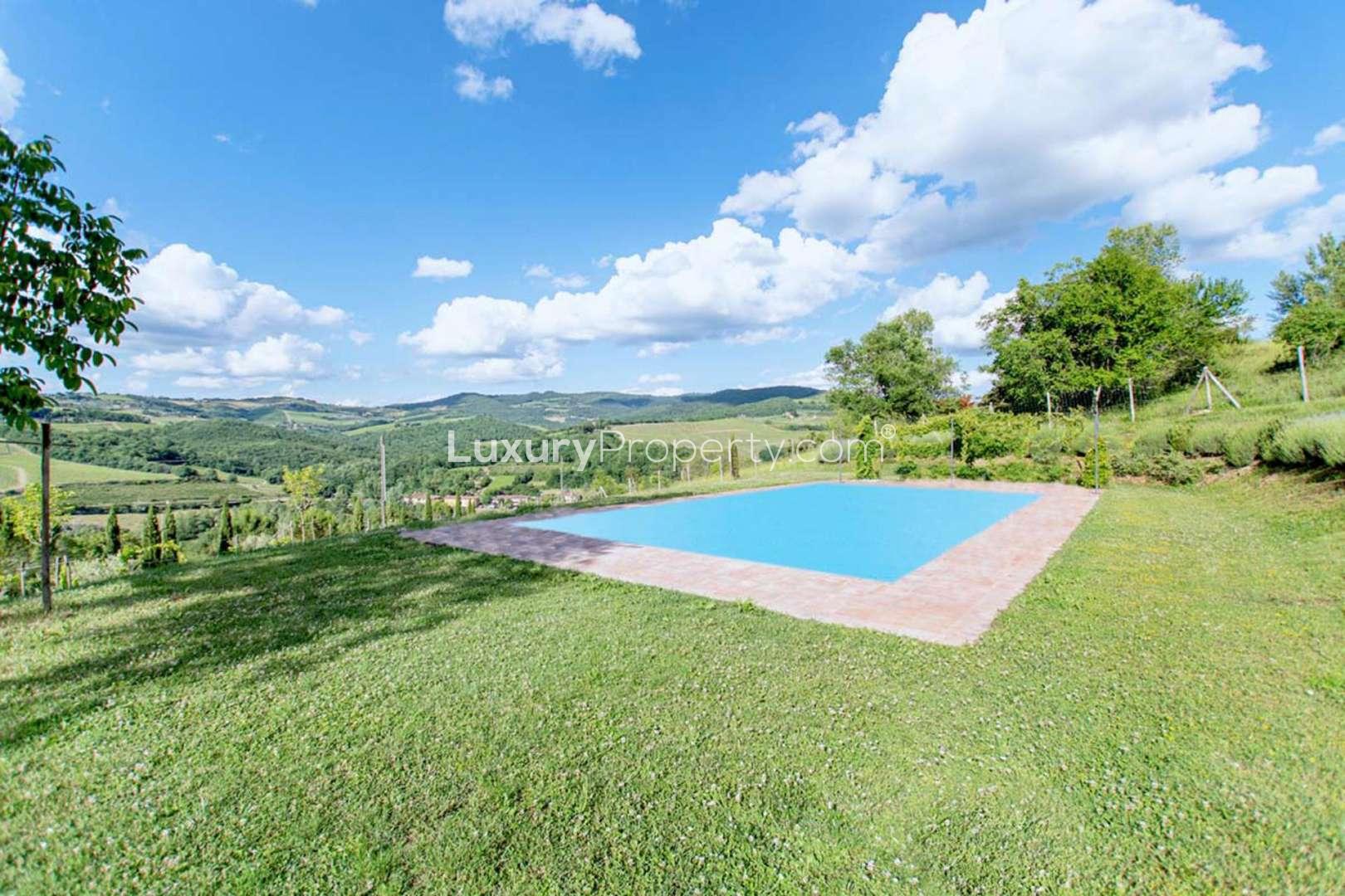 Outdoor seating area with scenic countryside views at farmhouse villa near Panzano, Florence