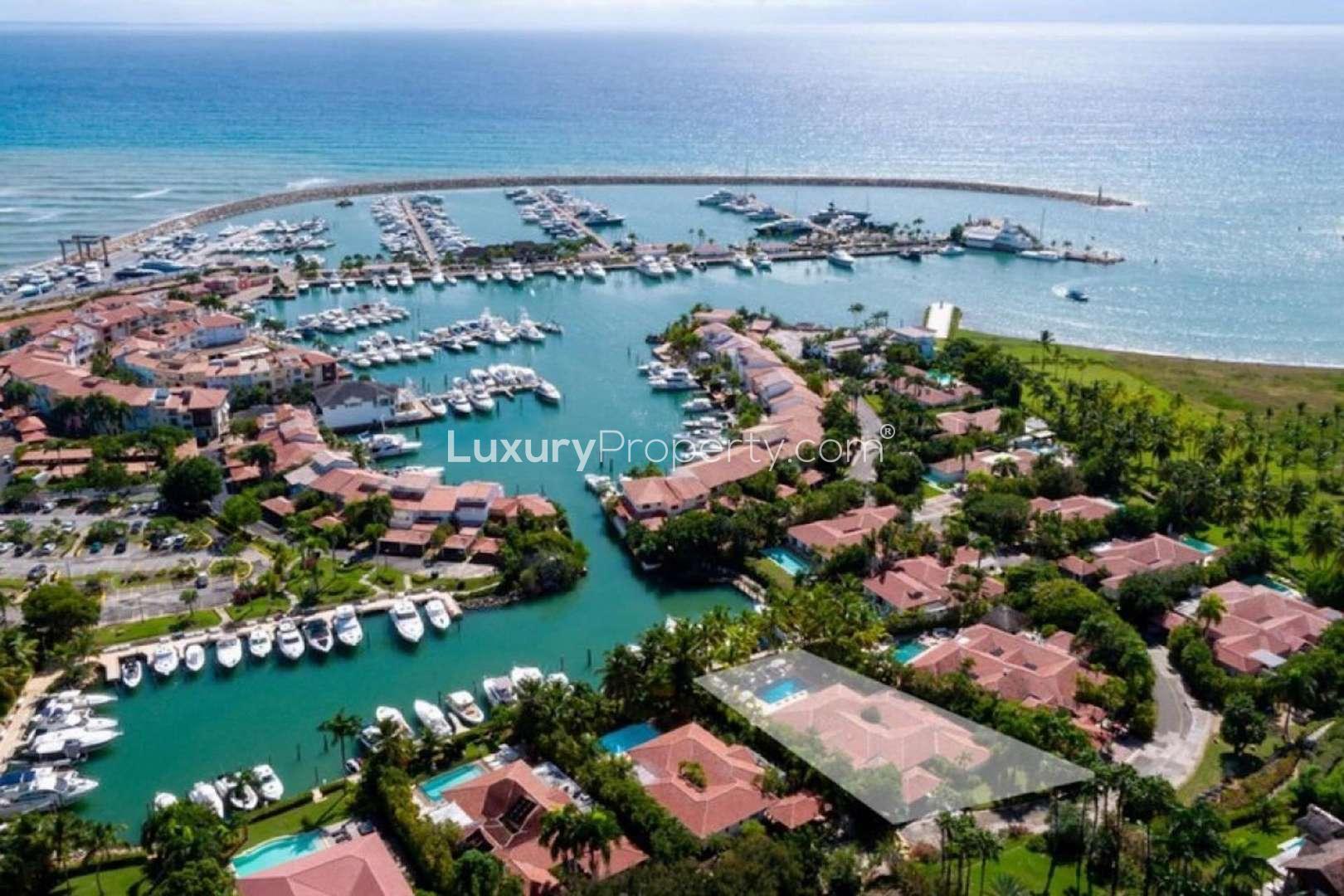 Luxurious poolside view at Villa Darsena 19, La Romana, with sun loungers and palm trees