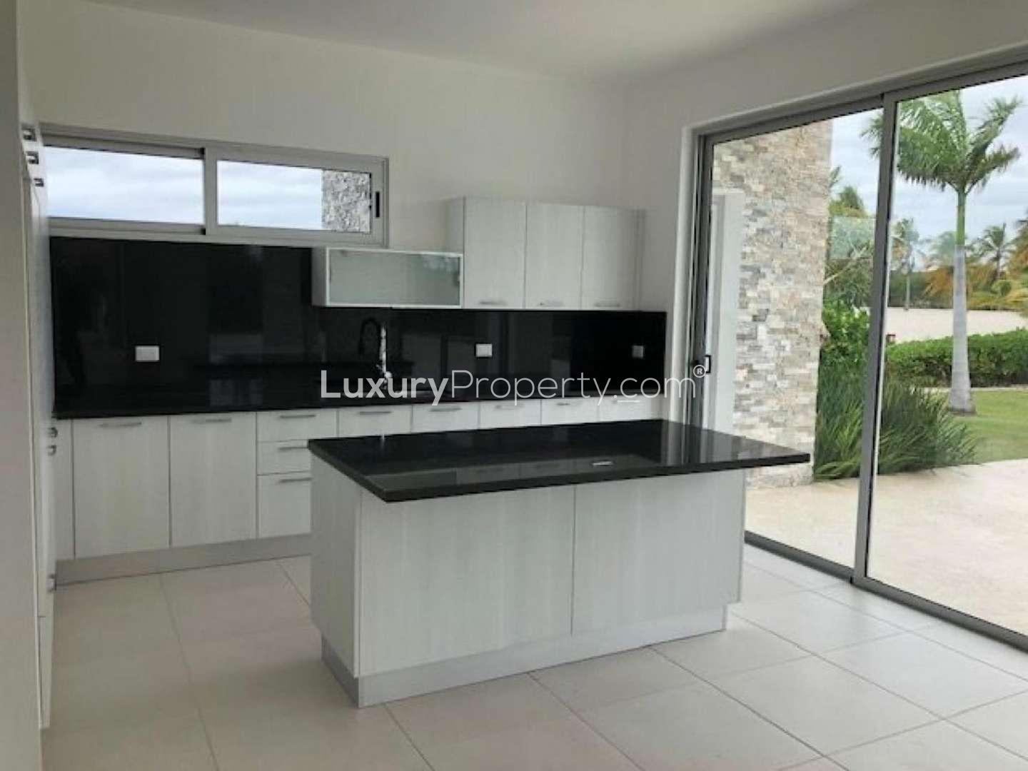 Modern villa interior with large windows and garden view in Cap Cana, Punta Cana