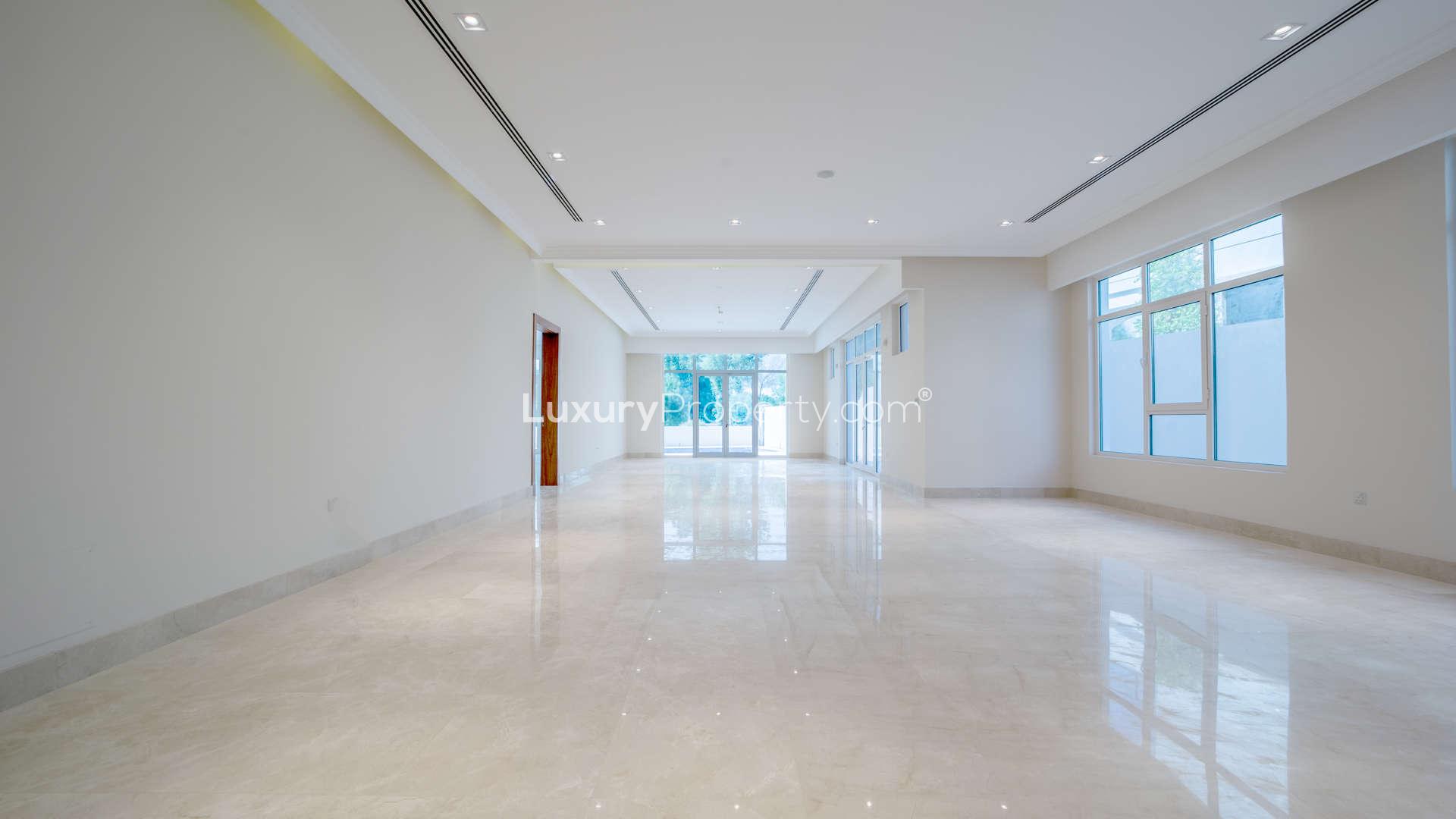 Empty room with large window, marble flooring in 5-bedroom villa, Jumeirah Golf Estates