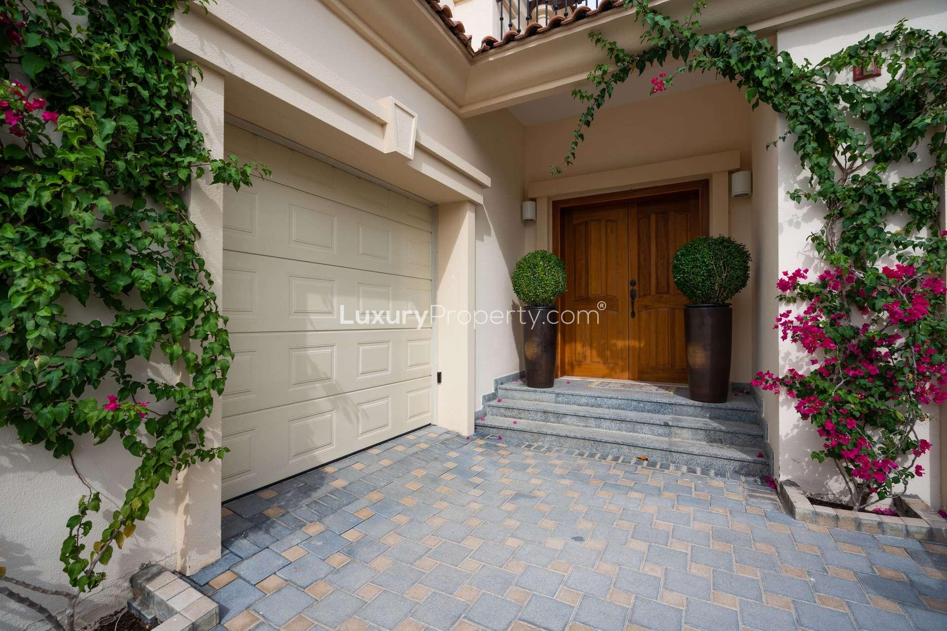 Elegant bathroom in 5-bedroom villa, Jumeirah Golf Estates, featuring dual sinks and bathtub