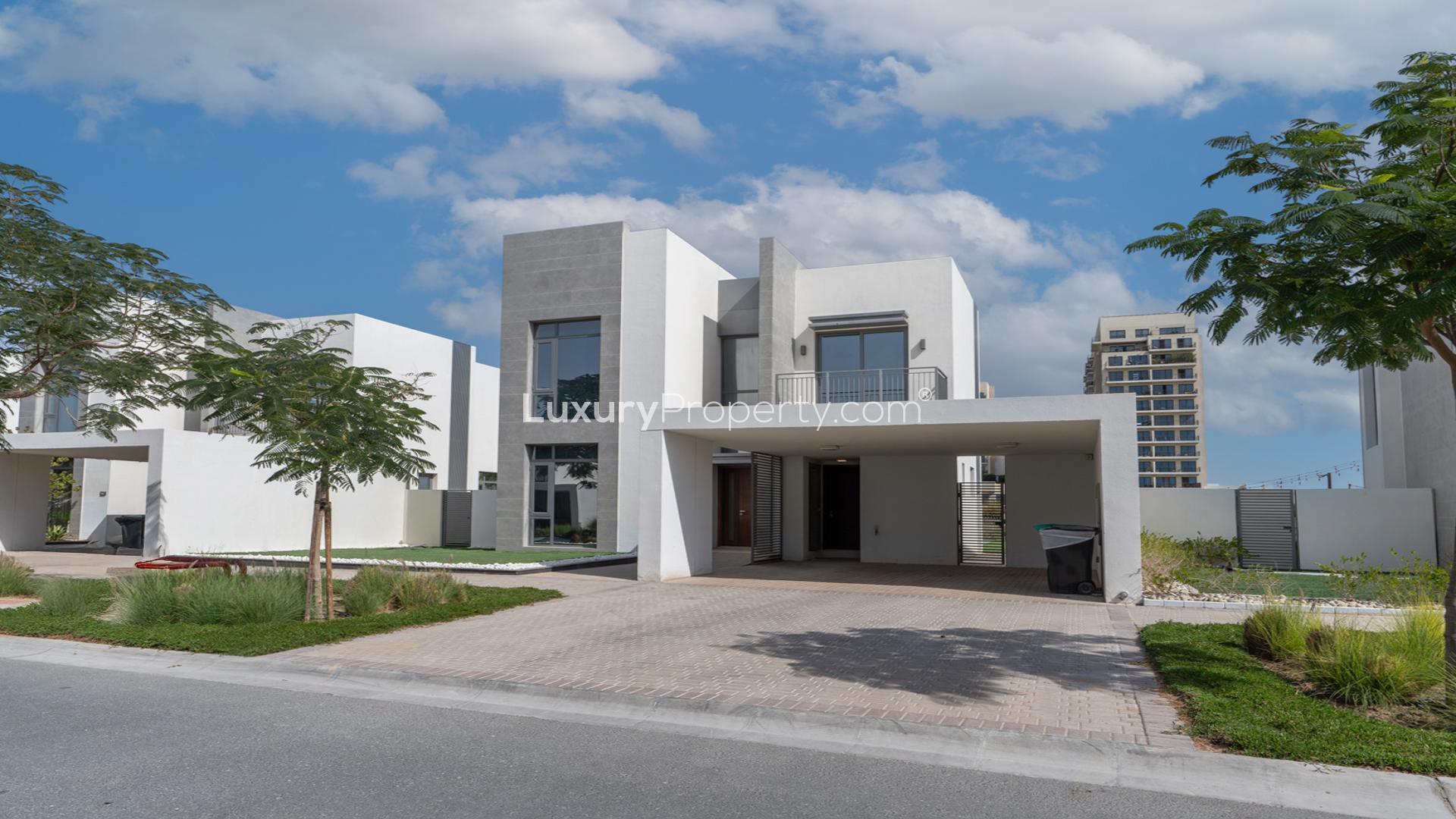 "Modern 5-bedroom villa in Emaar South Golf Links, upgraded and vacant, front exterior view.","Spacious upgraded villa interior with elegant flooring in Emaar South Golf Links community.",Vacant upgraded villa interior with golf course view in Emaar South Golf Links