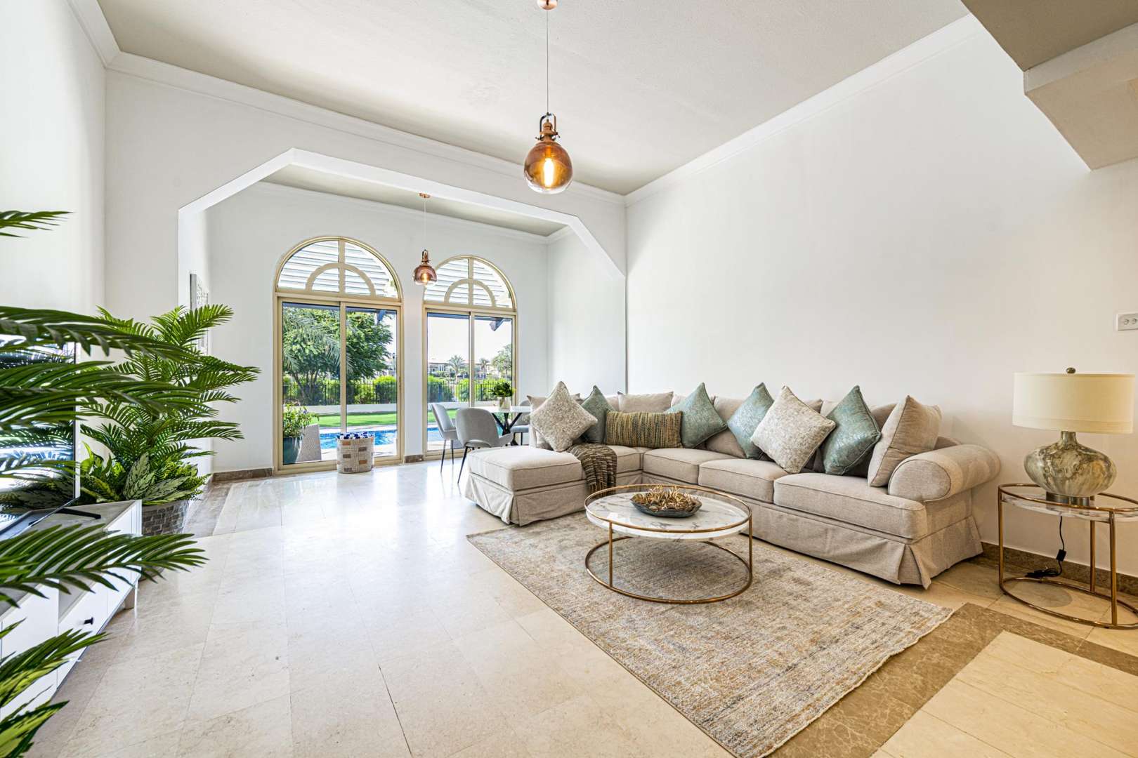 Luxurious Jumeirah Islands villa view with private pool and lush garden scenery