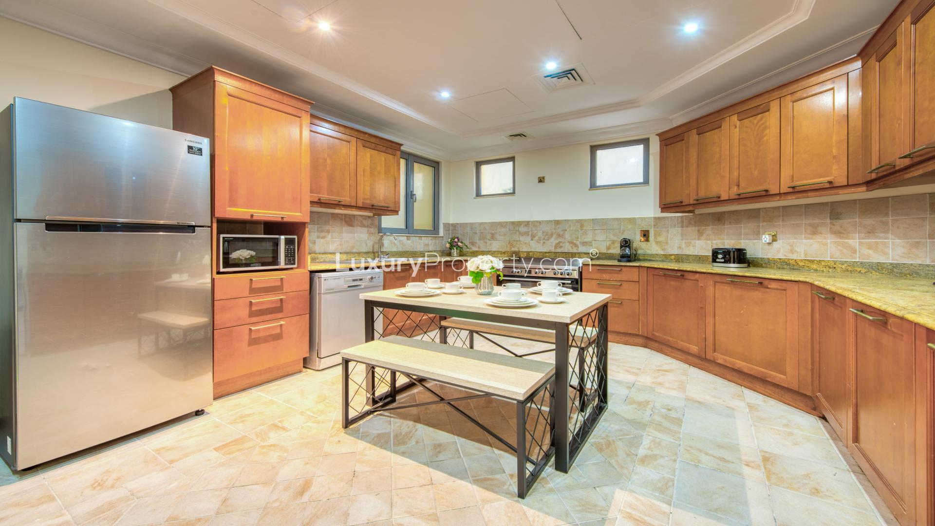Dining area in luxury Palm Jumeirah villa with elegant decor and natural light