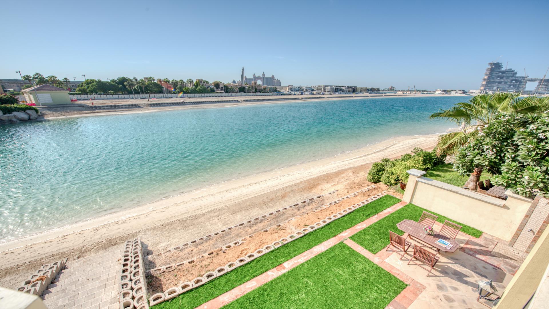 Luxurious living room in Palm Jumeirah villa with elegant decor and stunning sea view